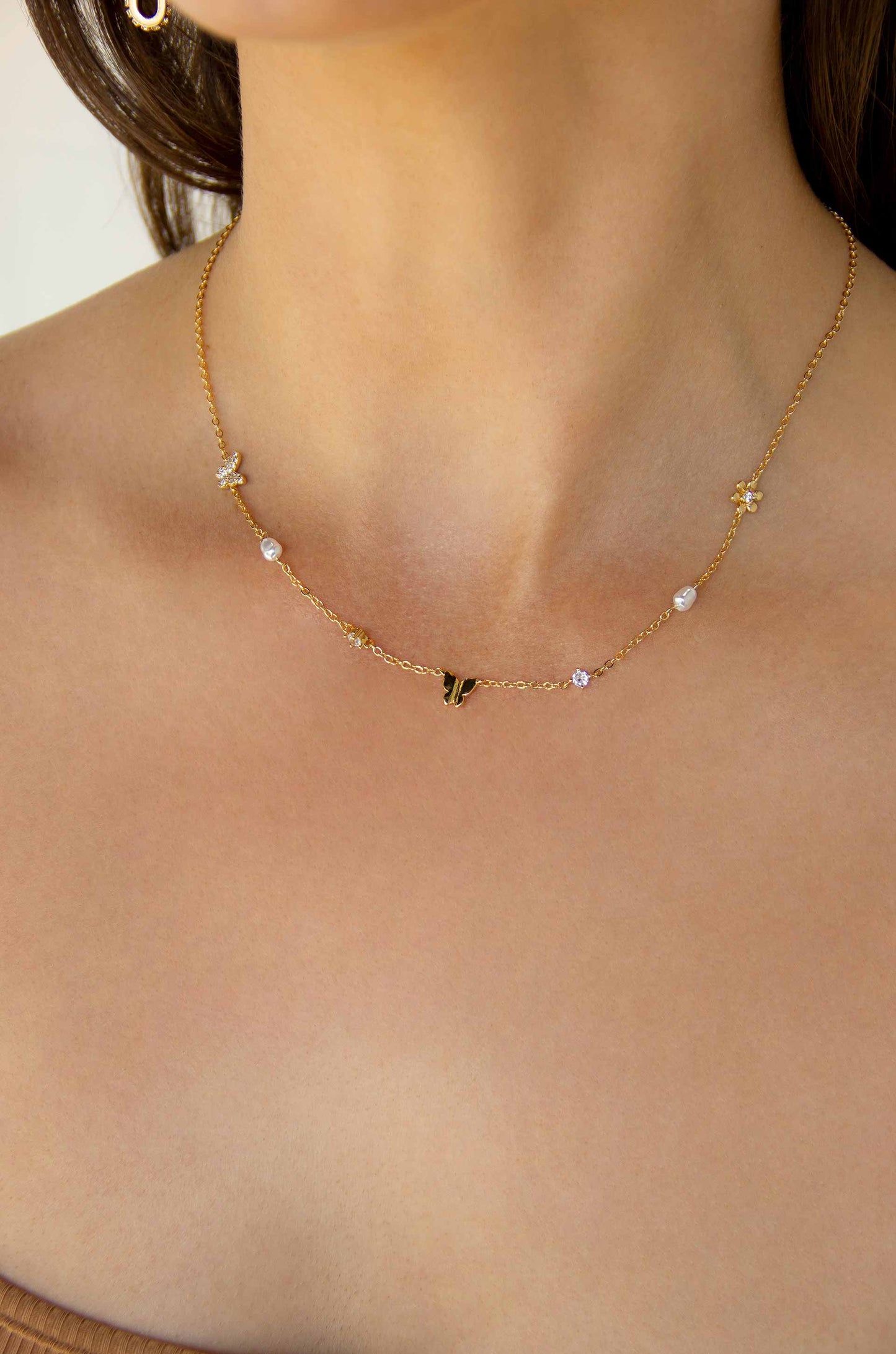 Subtle Butterflies and Pearl Necklace on model