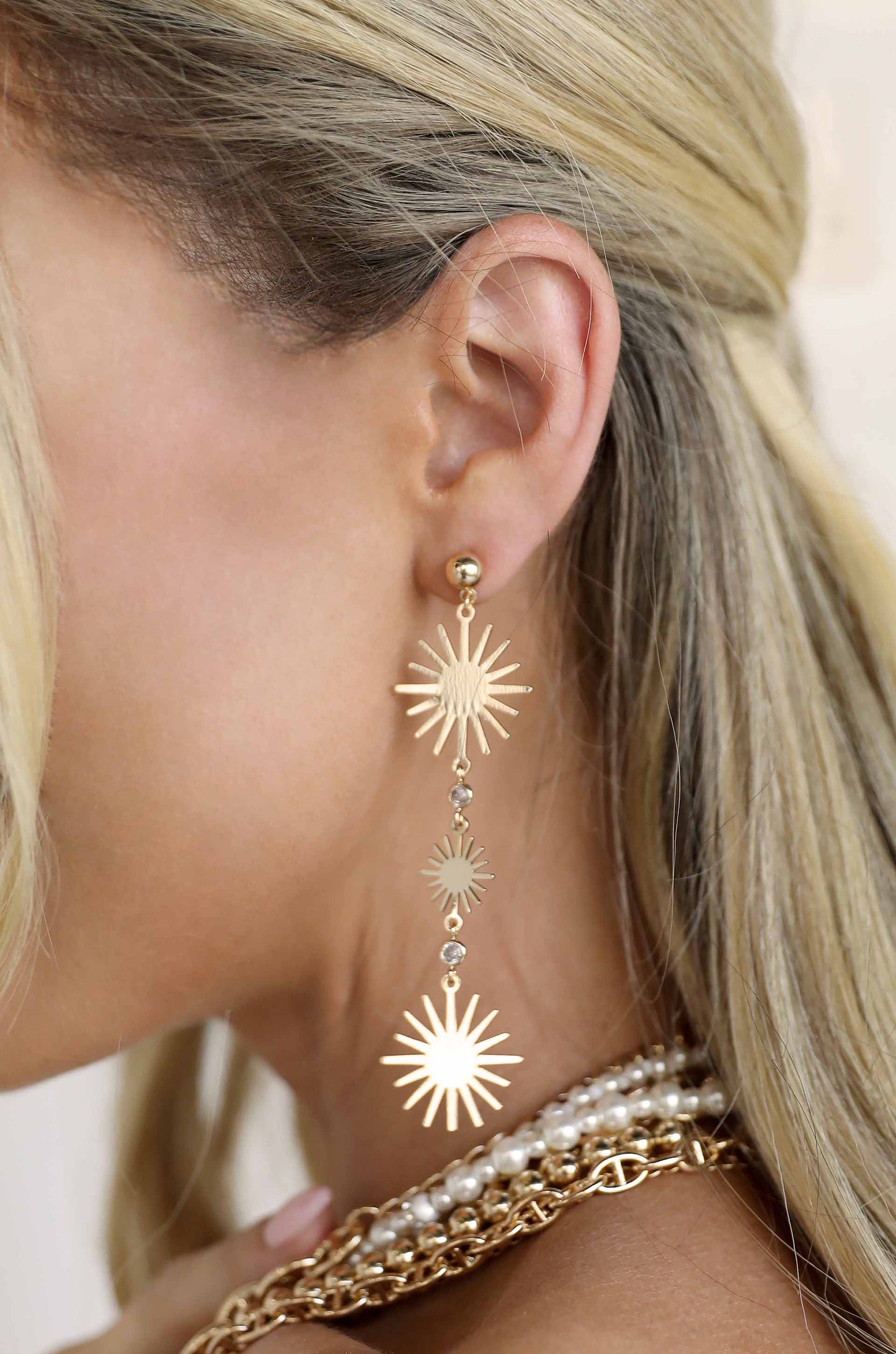 Sunburst Drop 18k Gold Plated Dangle Earrings on a model