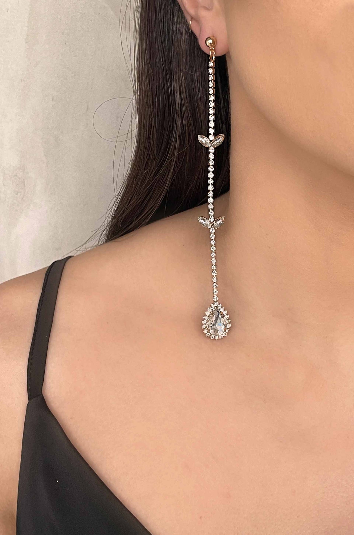 Mix It Up Crystal 18k Gold Plated Asymmetrical Earrings on a model