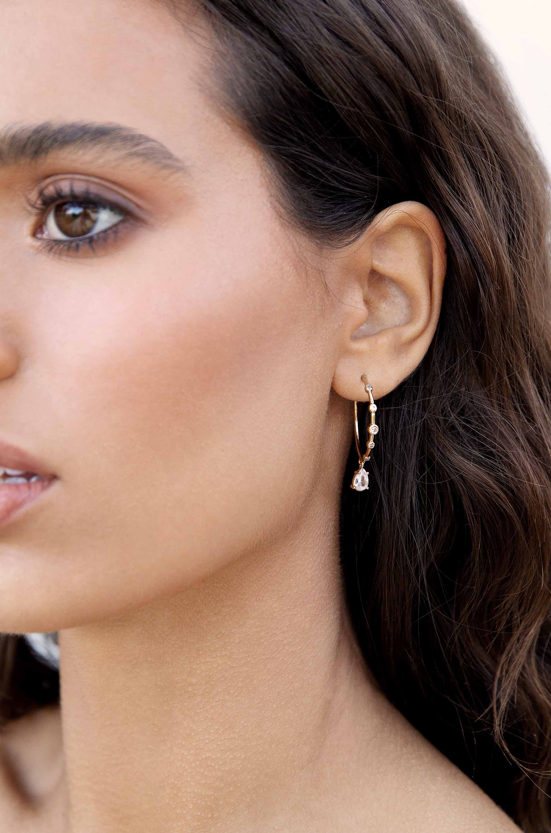 Delicate Crystal Charm Hoop Earrings on model
