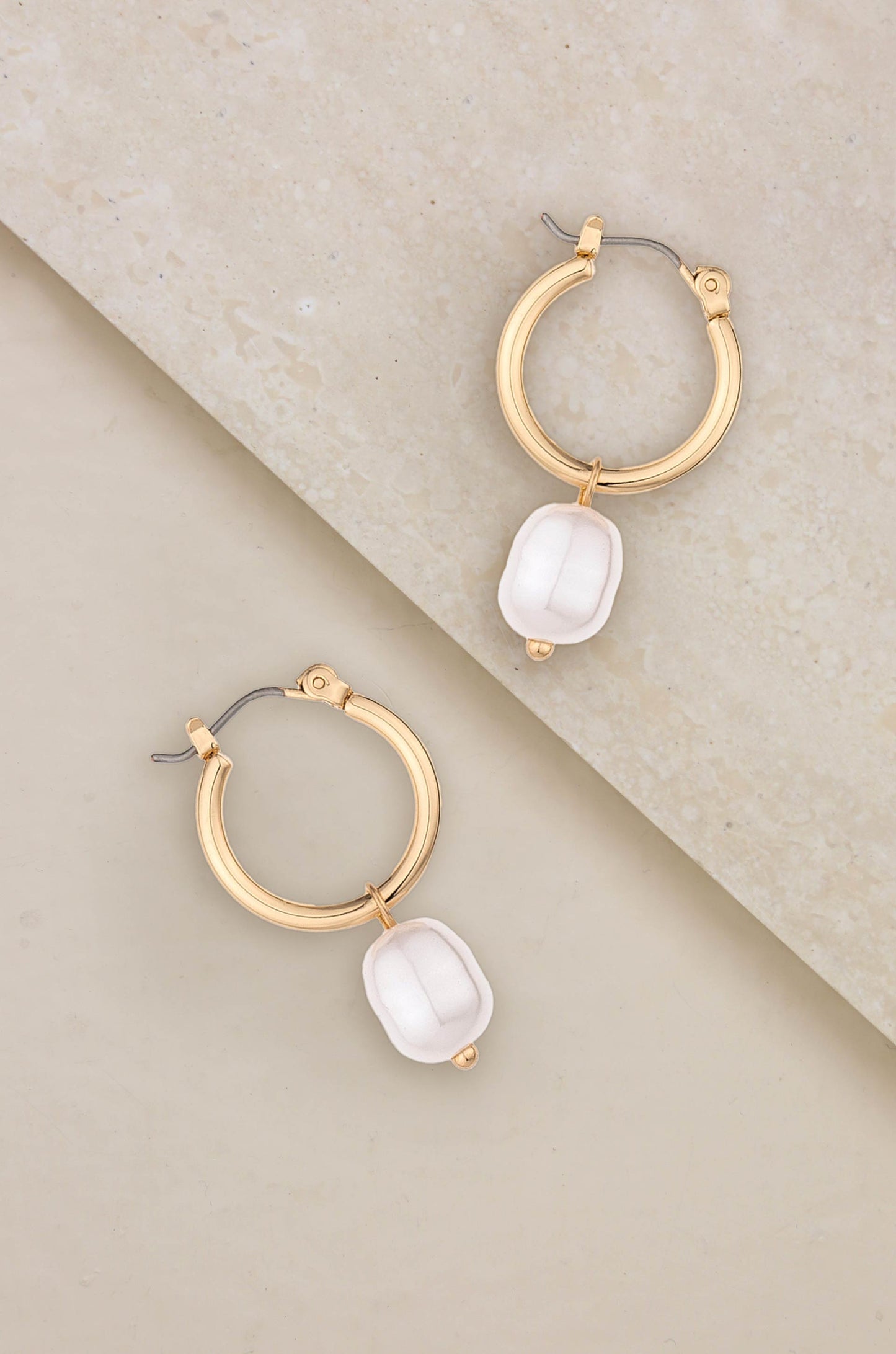 Removable Pearl Huggie Earrings on slate
