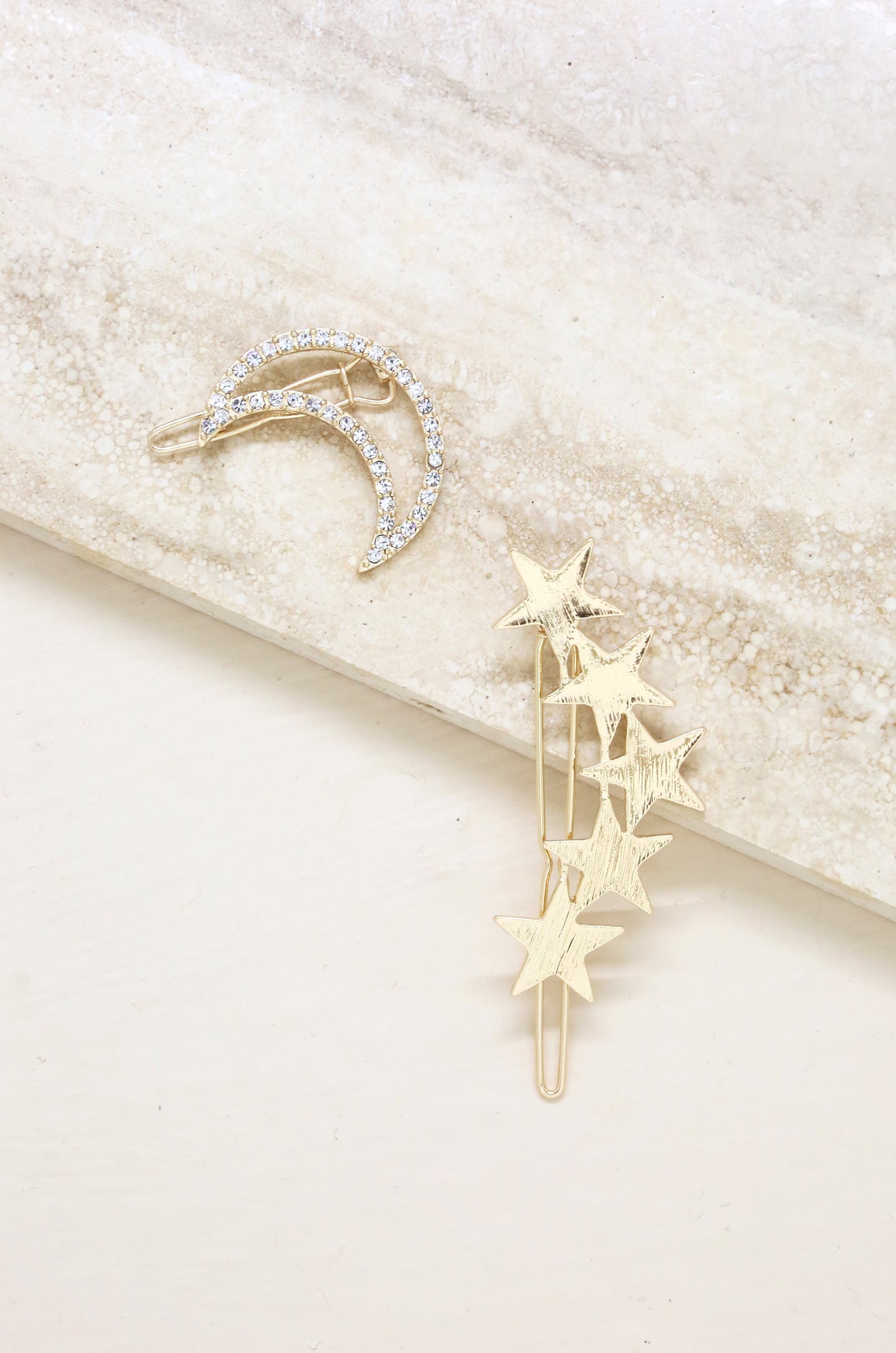 Stars and Moon Set of 2 Hair Barrettes in Gold on slate background