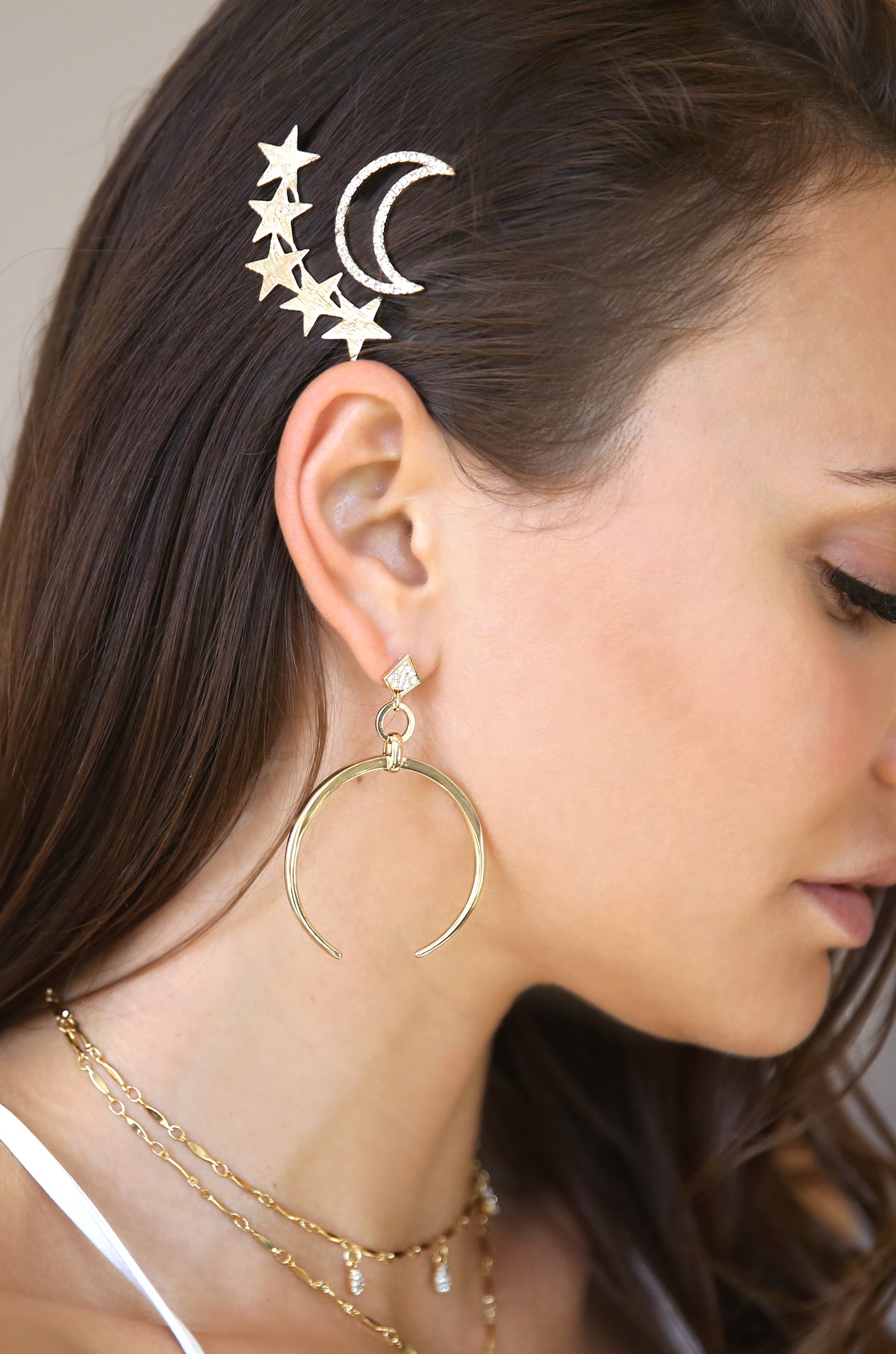 Stars and Moon Set of 2 Hair Barrettes in Gold shown on a model
