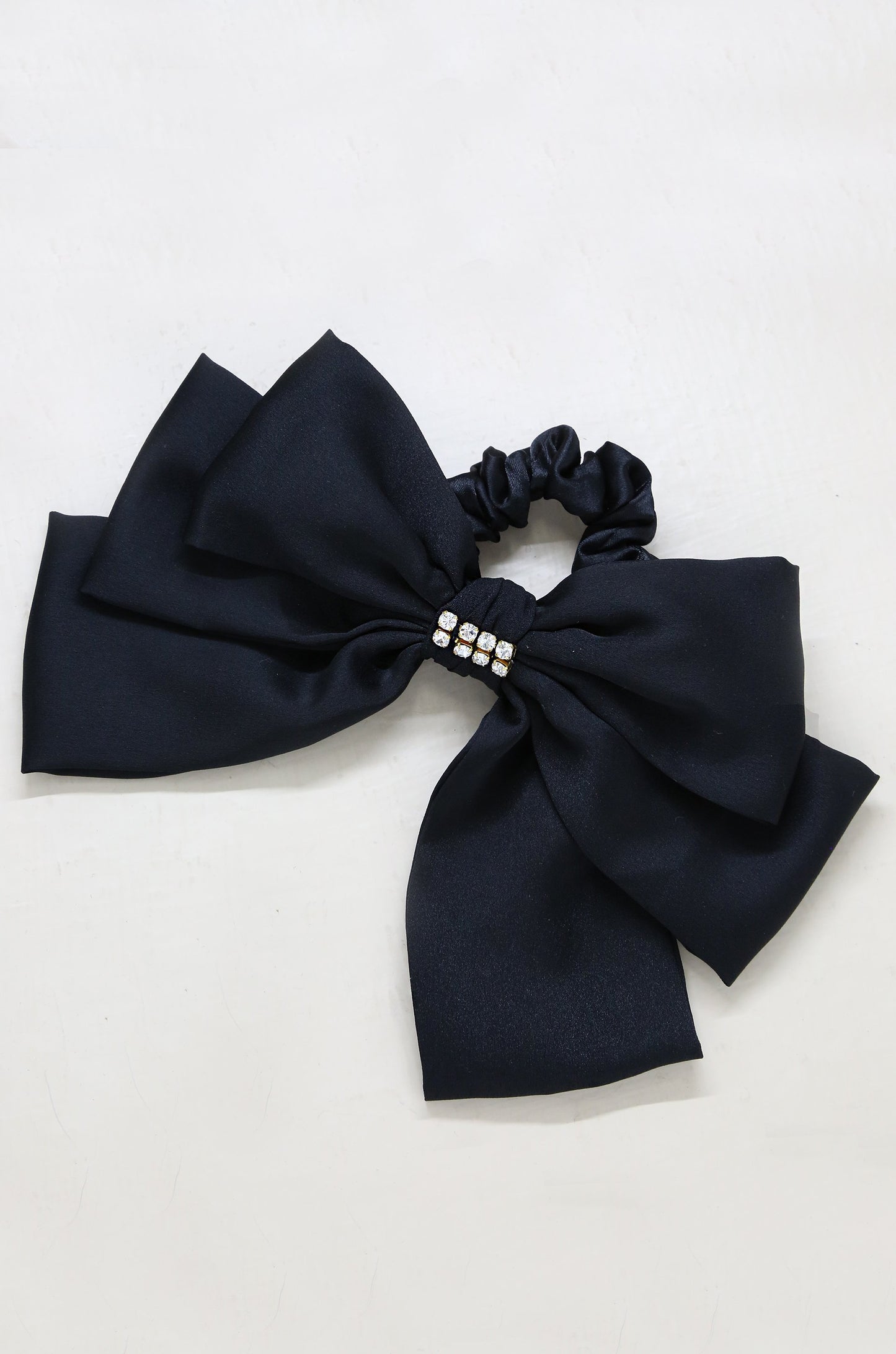Oversized Bow Scrunchie with Crystal in Black on slate background