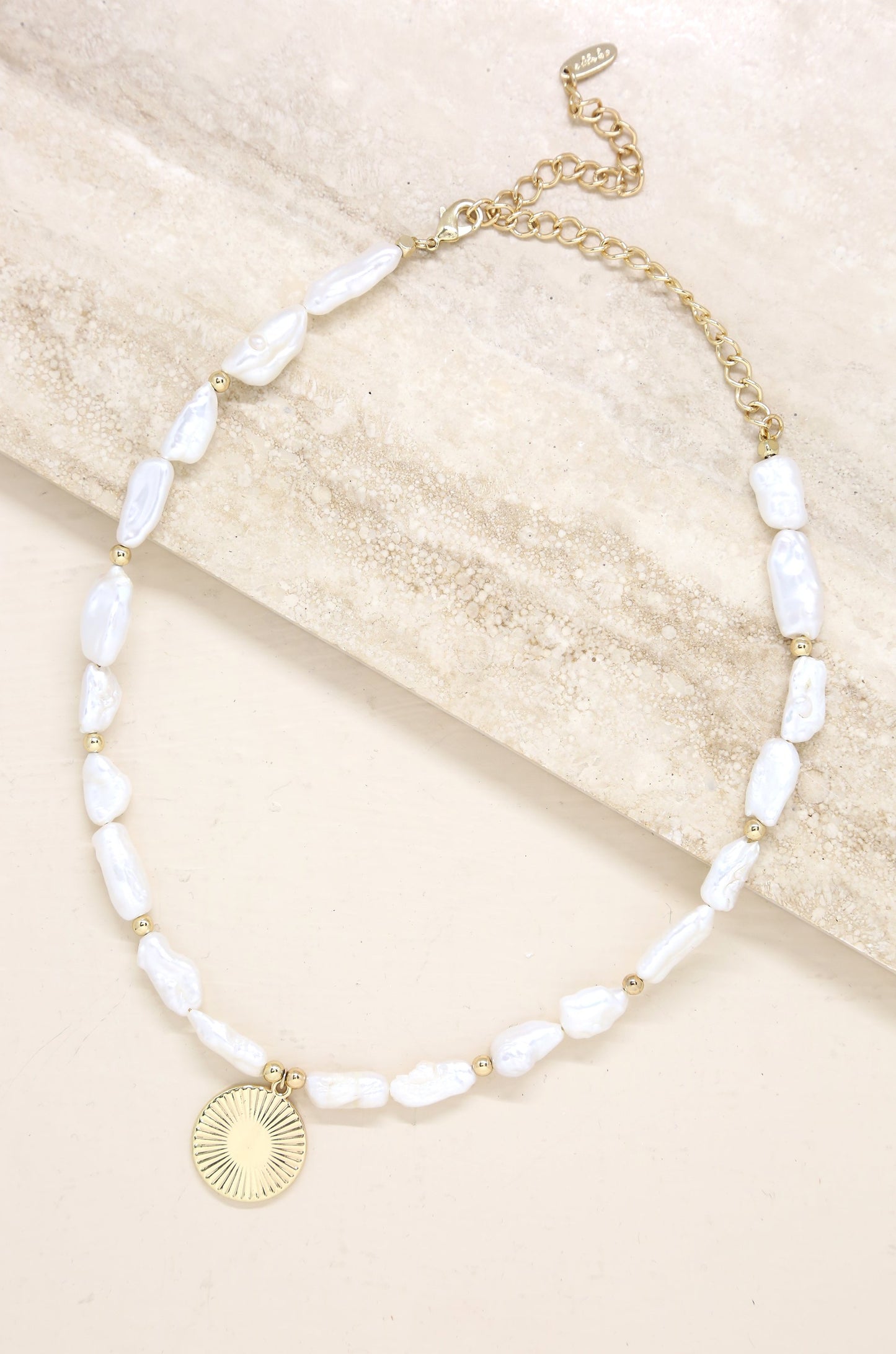 Paloma Pearl 18k Gold Plated Coin Necklace on slate background