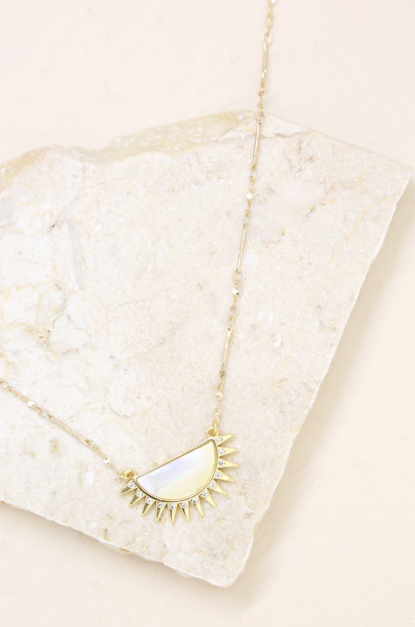 Sunset Reflection Mother of Pearl 18k Gold Plated Pendant Necklace on slate background