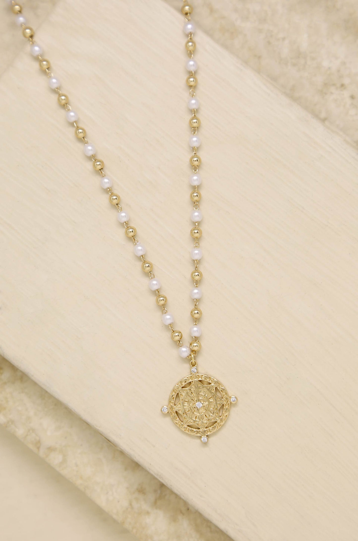Long Travels Pearl & 18k Gold Plated Ball Chain Necklace on slate background