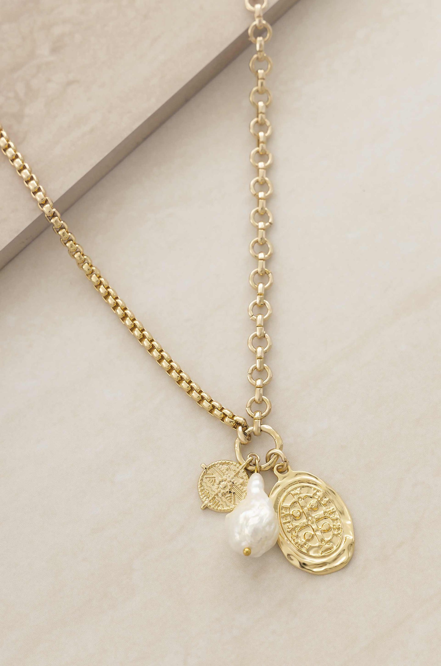 Freshwater Pearl Treasures 18k Gold Plated Charm Necklace on slate background