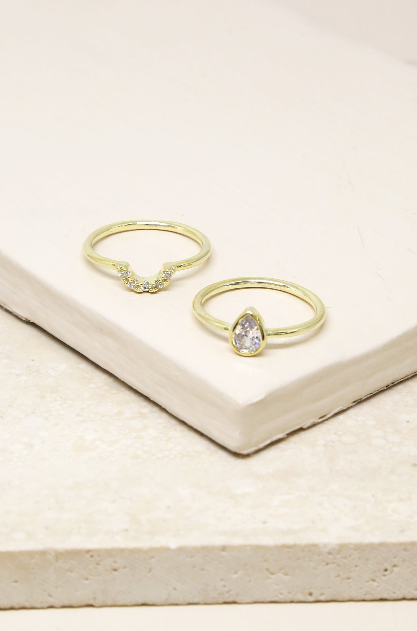 Perfect Fit Crystal 18k Gold Plated Stacking Ring Set on slate background