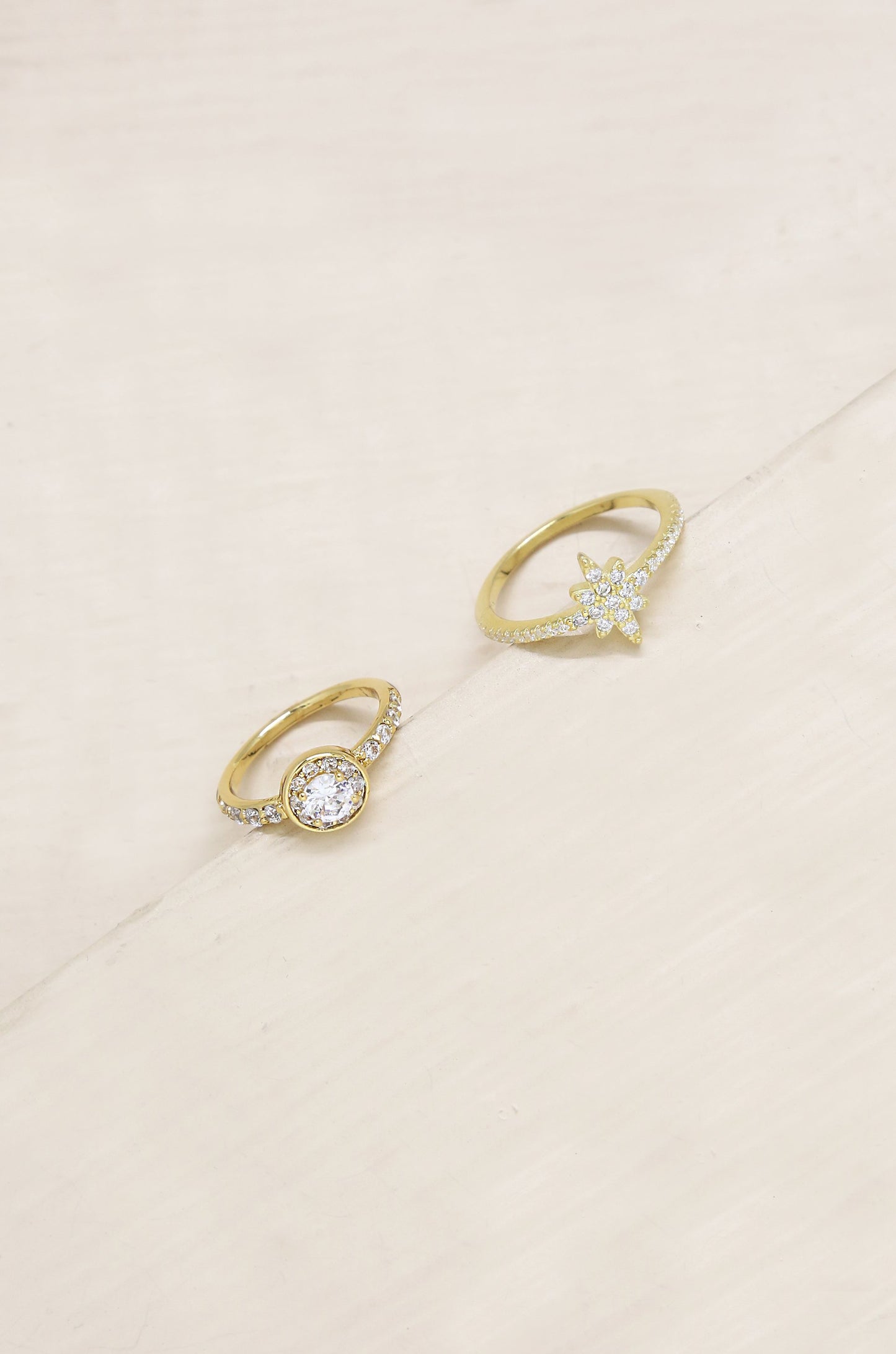Star Studded Crystal 18k Gold Plated Ring Set on slate background
