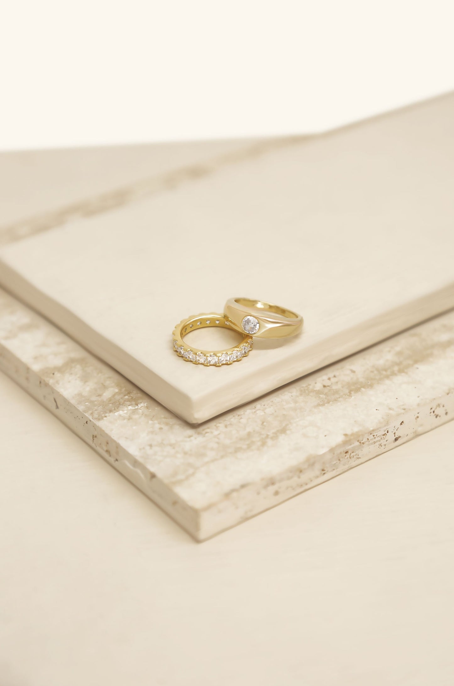 Simple Touch Crystal & 18k Gold Plated Ring Set on slate background