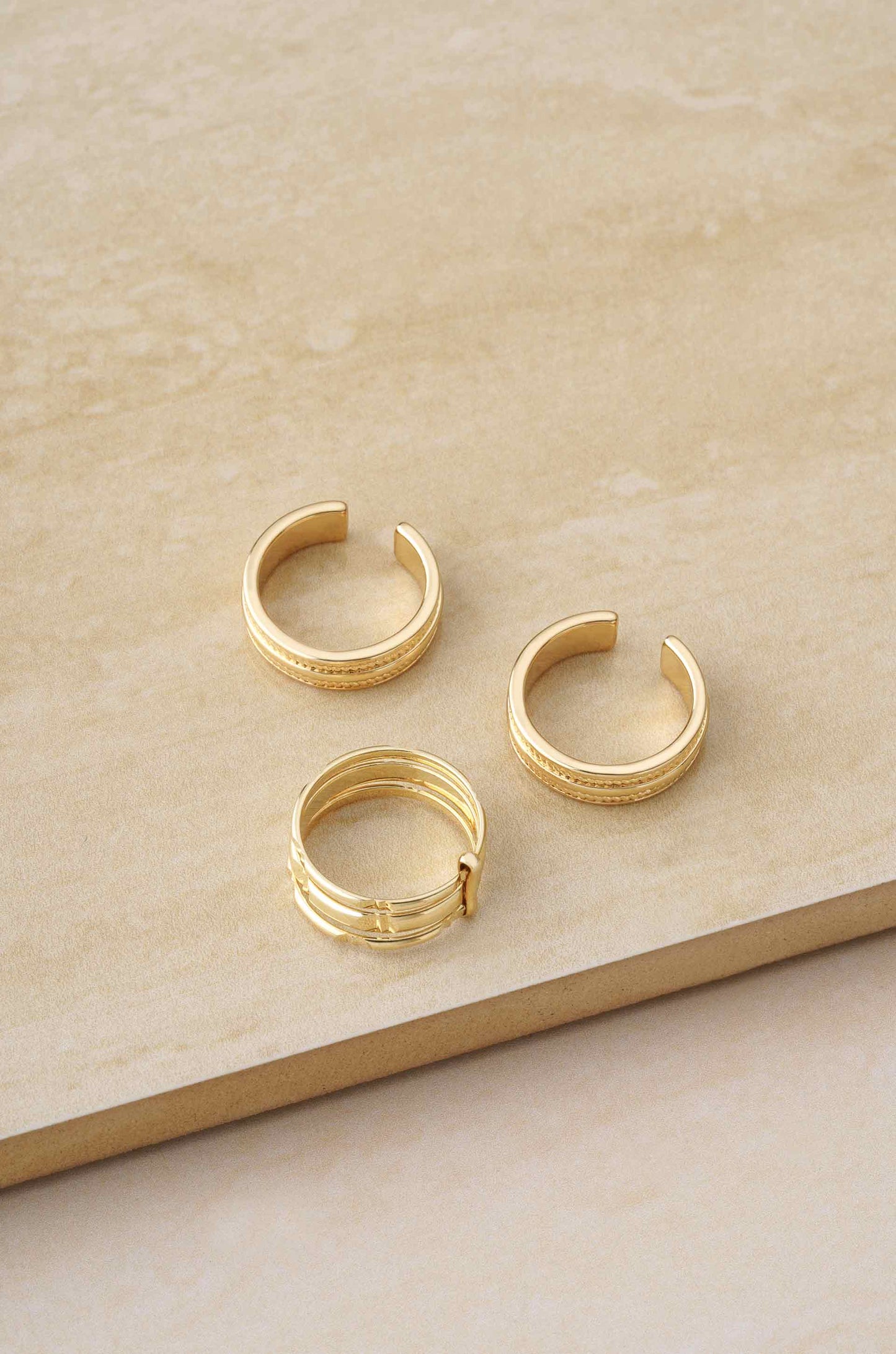 Easy Golden Stackers 18k Gold Plated Ring Set on slate background