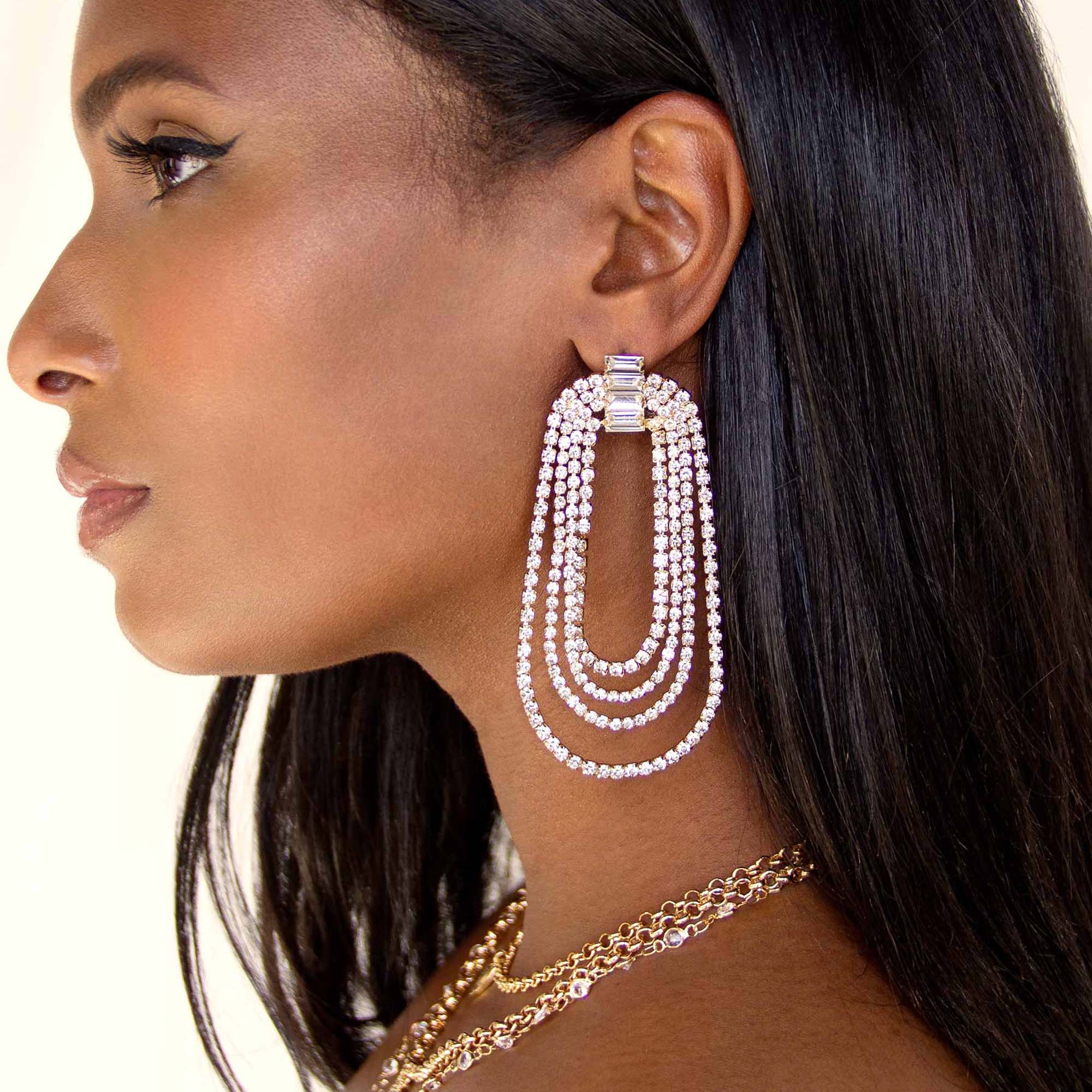 Model in Ettika Earrings