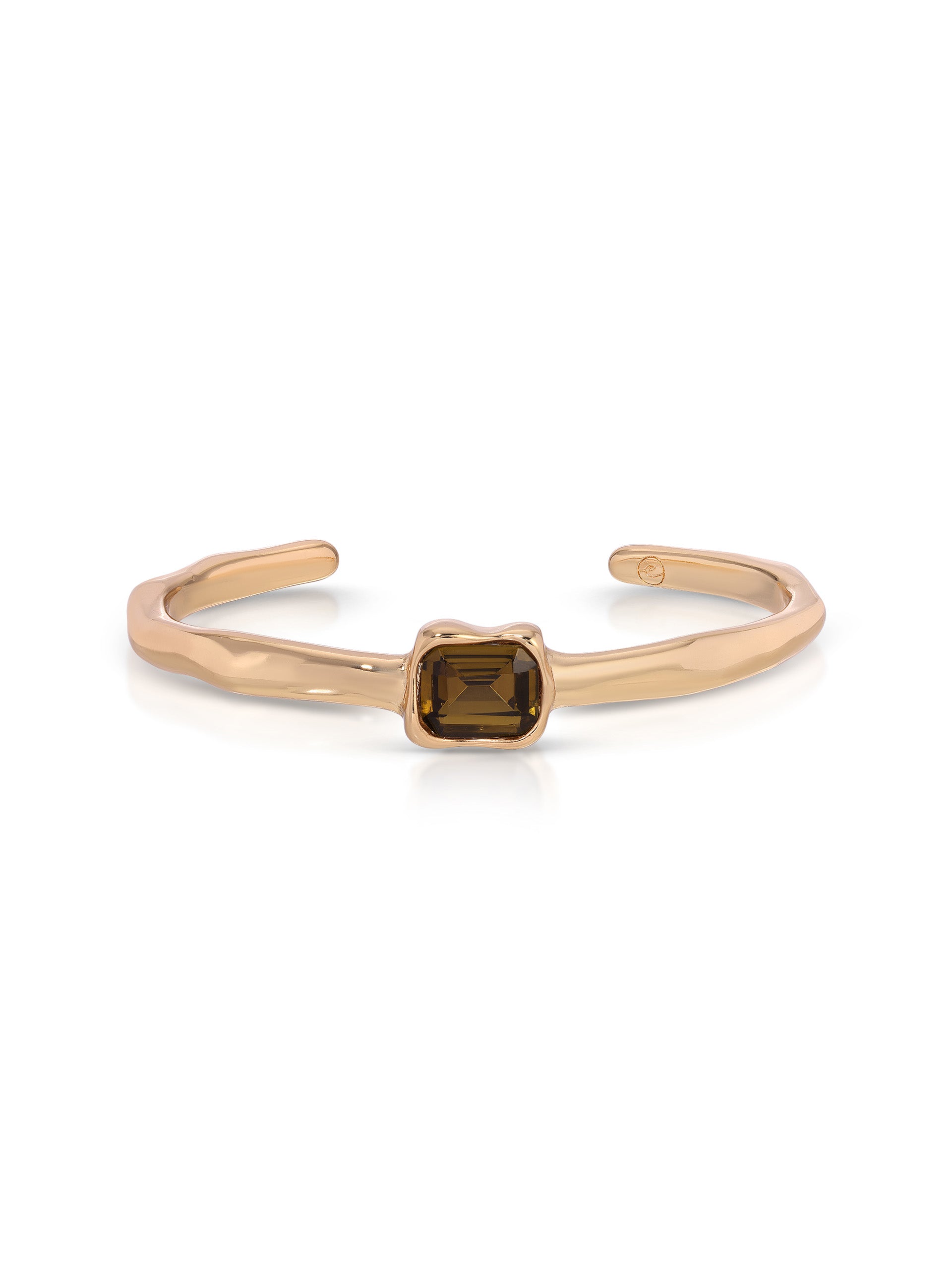 A gold-toned open cuff bracelet featuring a central square-cut smoky brown gemstone, set against a clean white background.