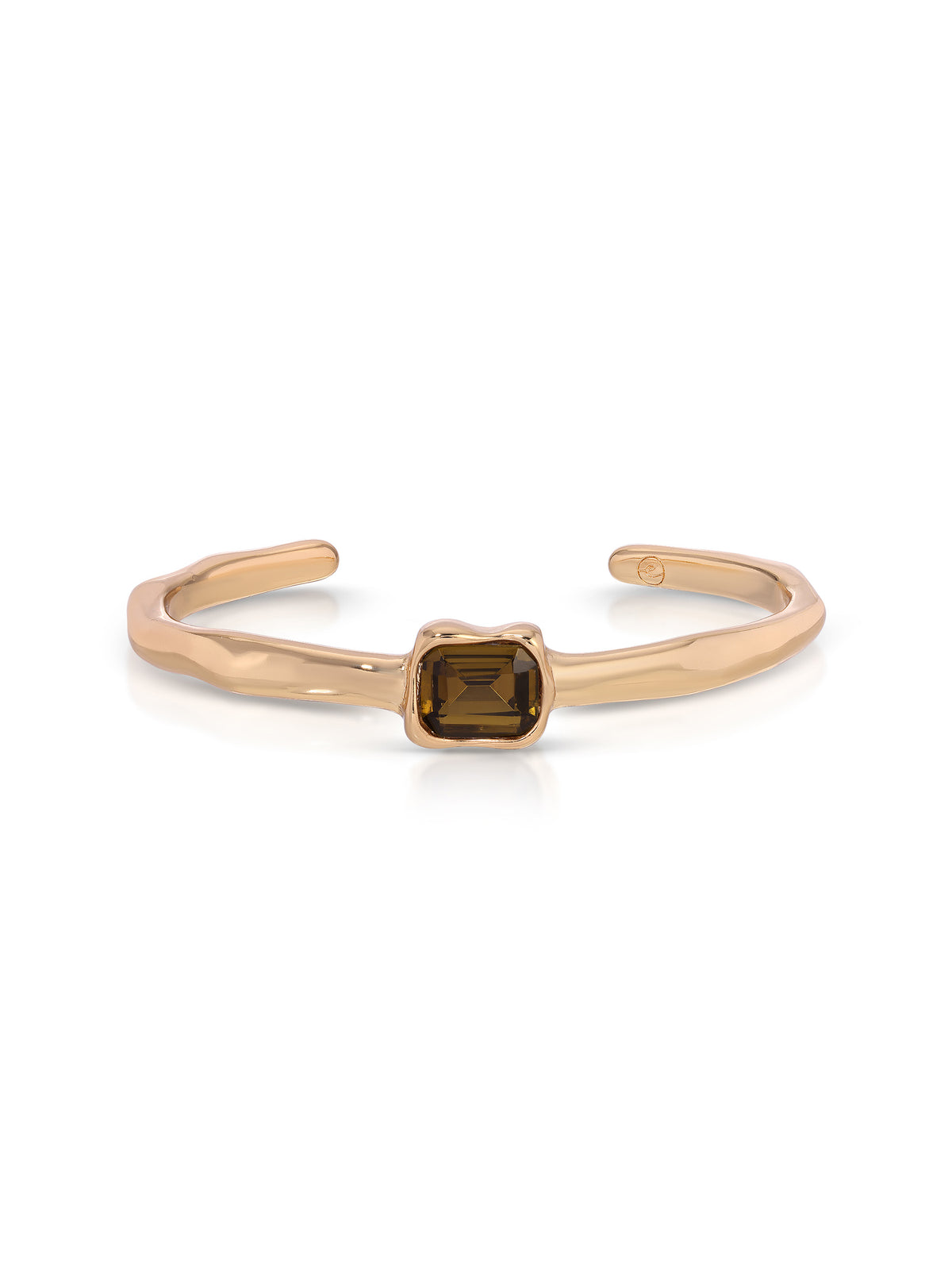 A gold-toned open cuff bracelet featuring a central square-cut smoky brown gemstone, set against a clean white background.