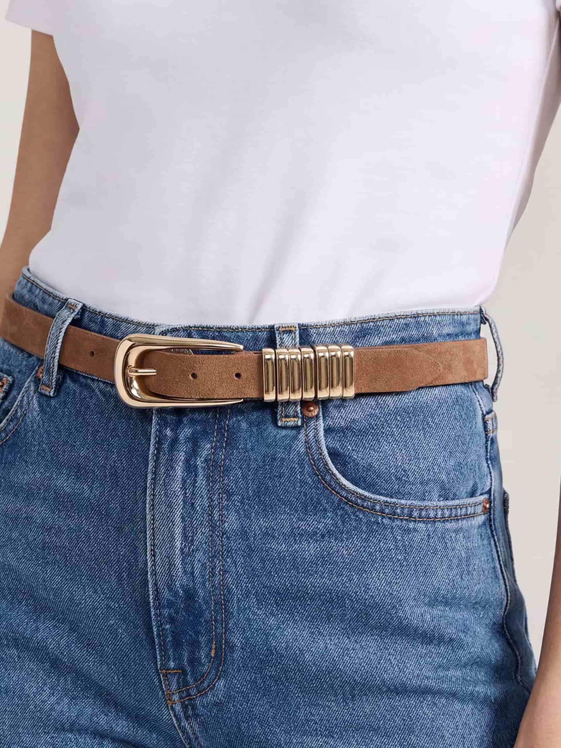 Mocha belt with gold bar detail styled with blue jeans.