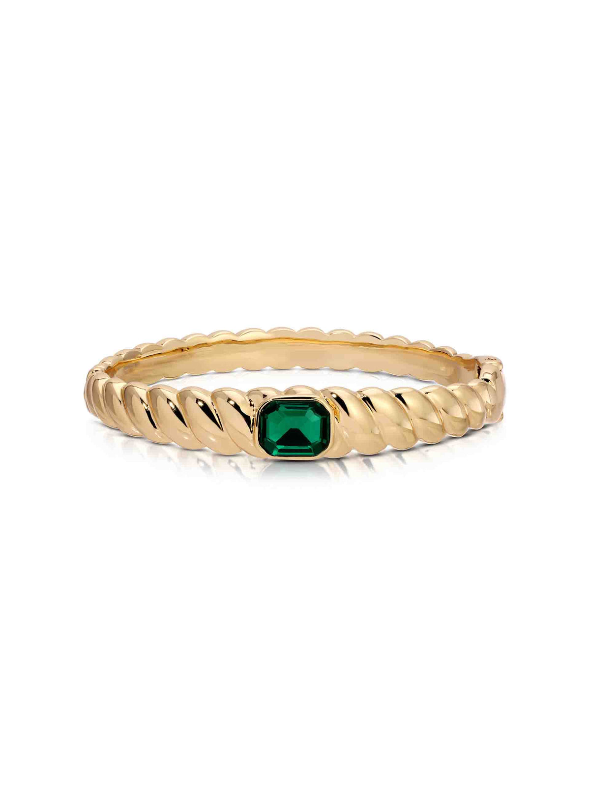 Gold twisted bangle bracelet featuring a central oval emerald-green gemstone in a bezel setting, photographed on a clean white background.