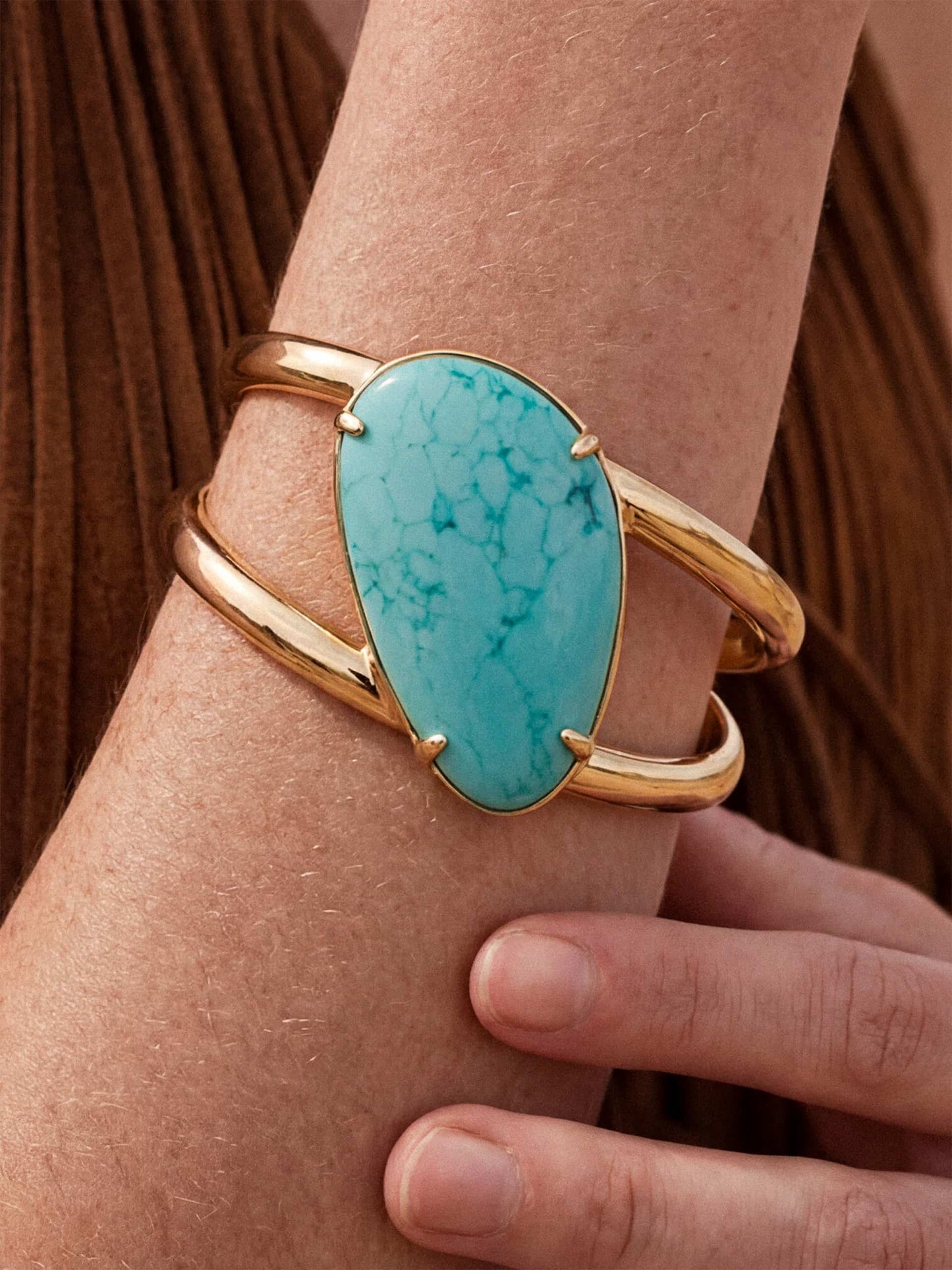 Turquoise cuff bracelet on wrist
