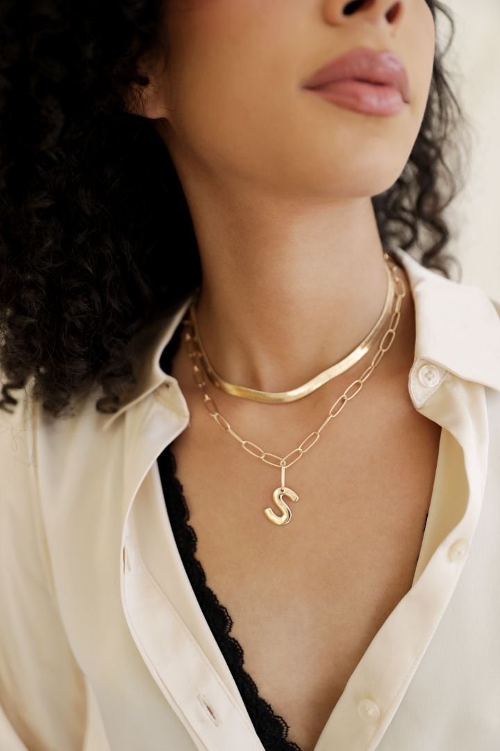 model in snake chain and initial necklace
