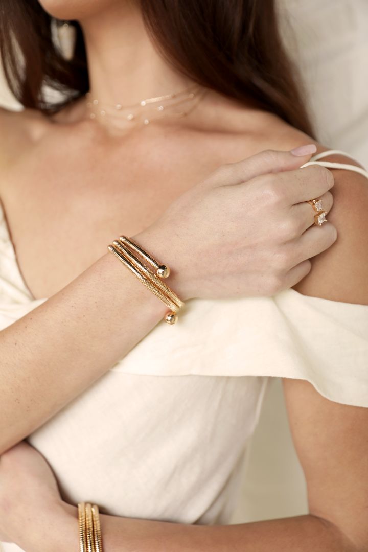 model in gold spring band bracelet
