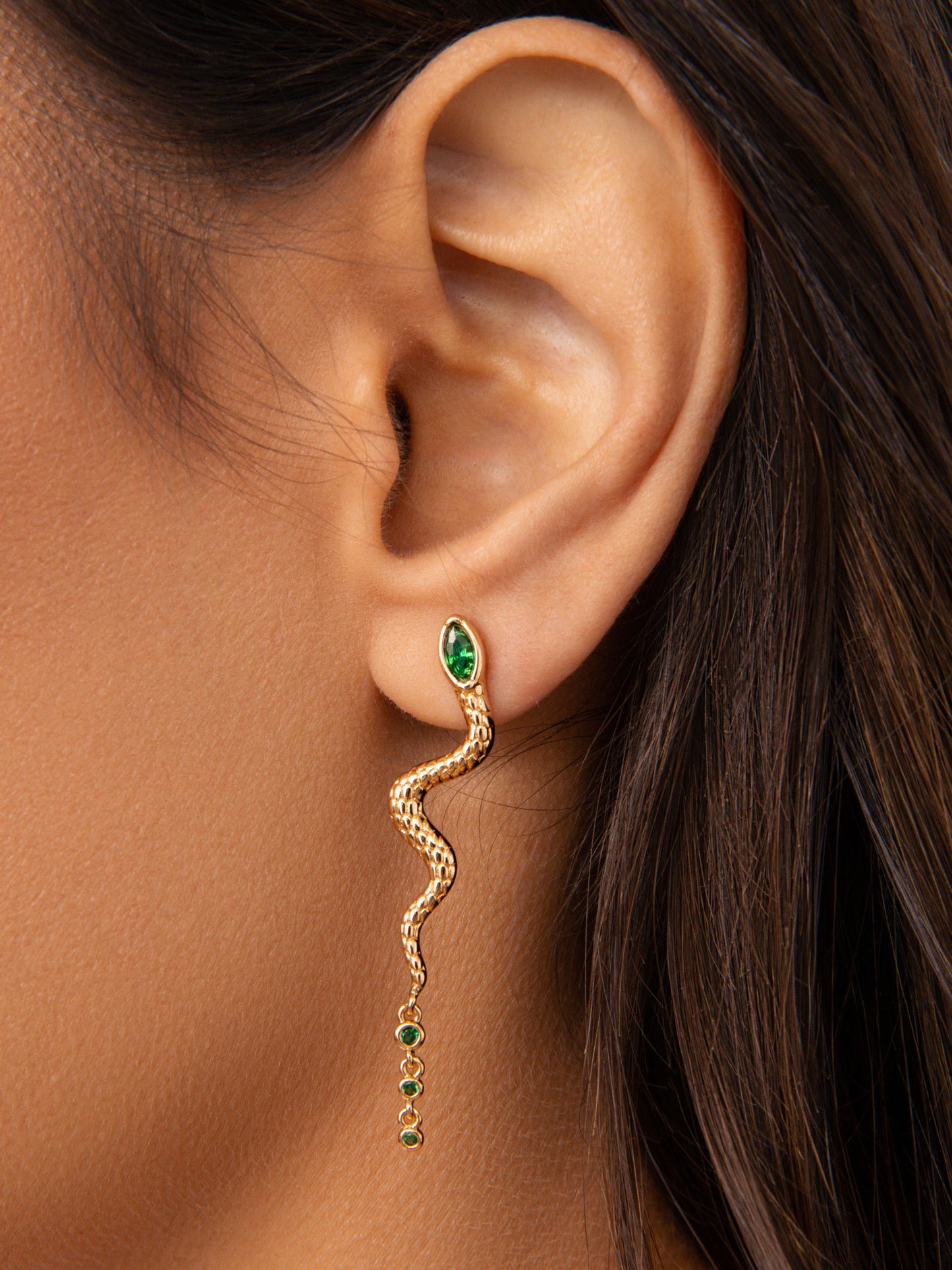 Serpentina Earrings Emerald Crystal with 18k Gold Plating on model