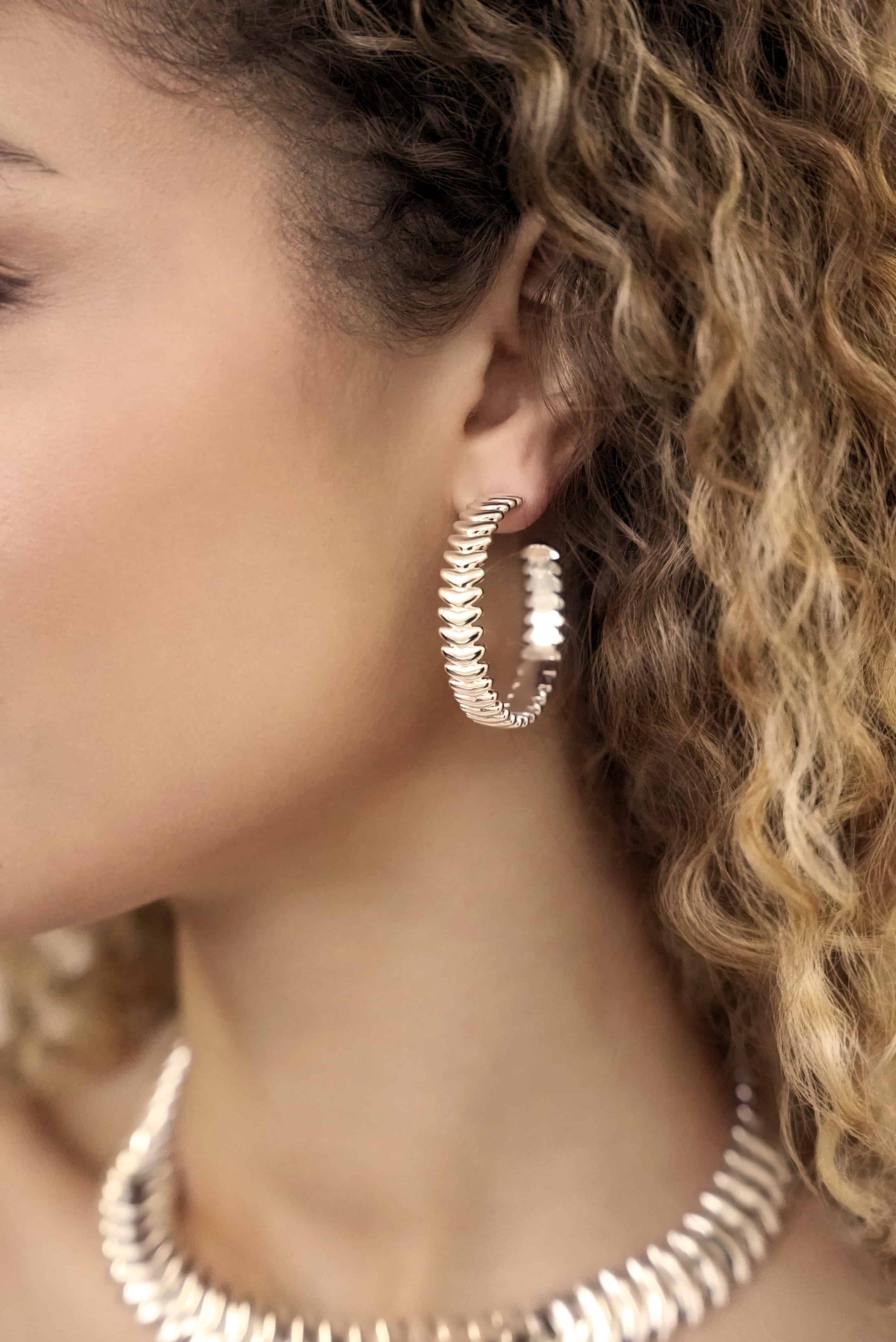 Model weaing Large Metal Moderna Hoops Gold Plated