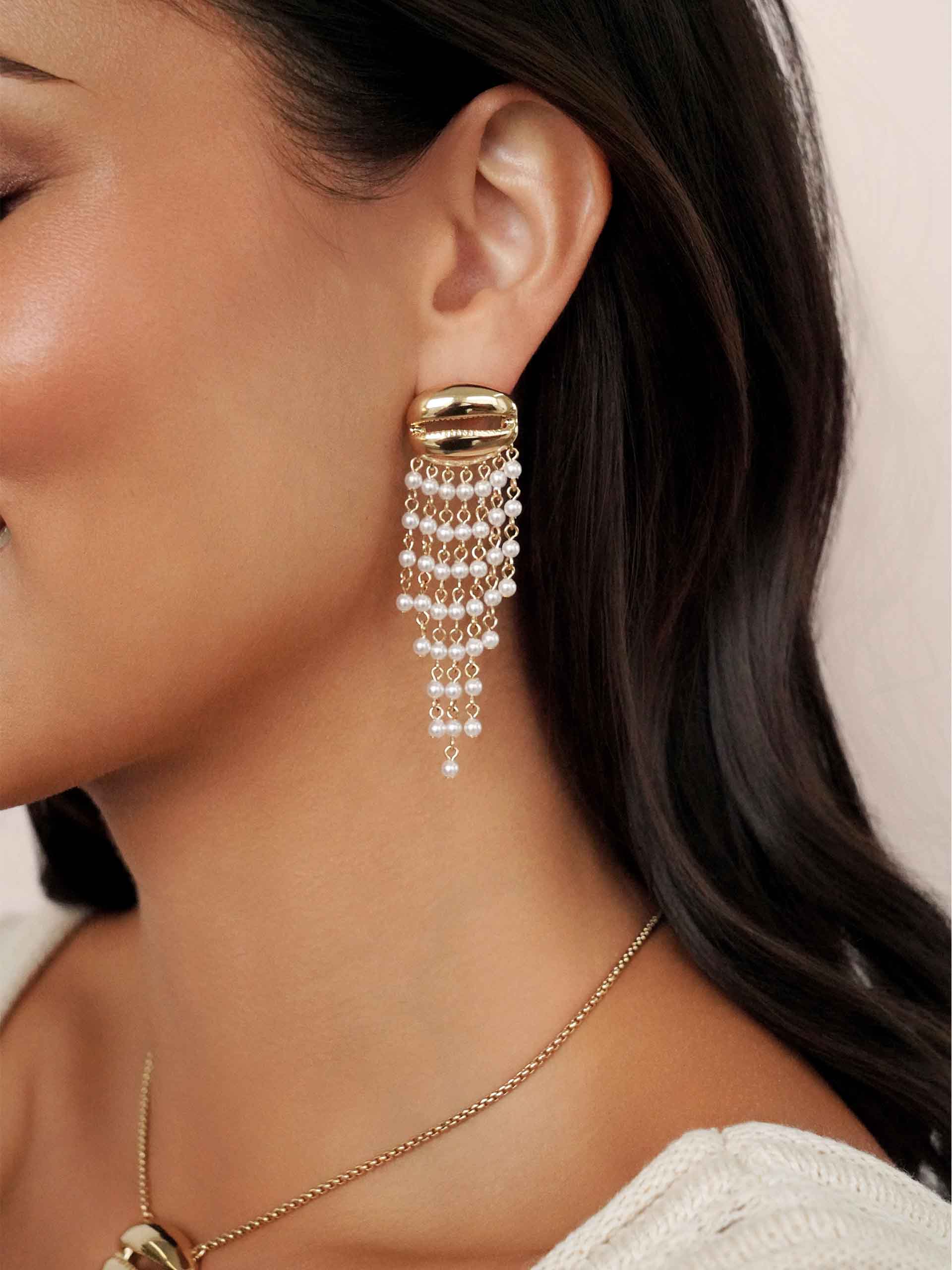 Mykonos Shell Dangle Earrings on model 2
