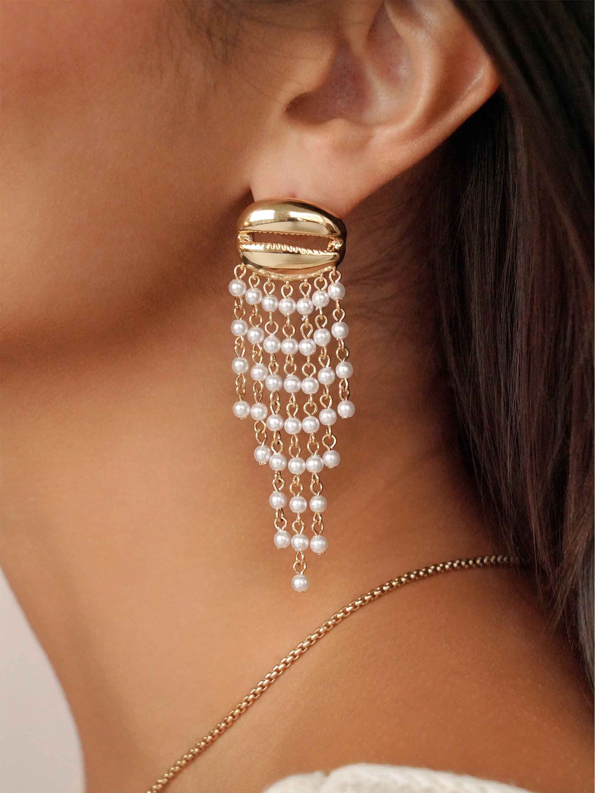 Mykonos Shell Dangle Earrings on model