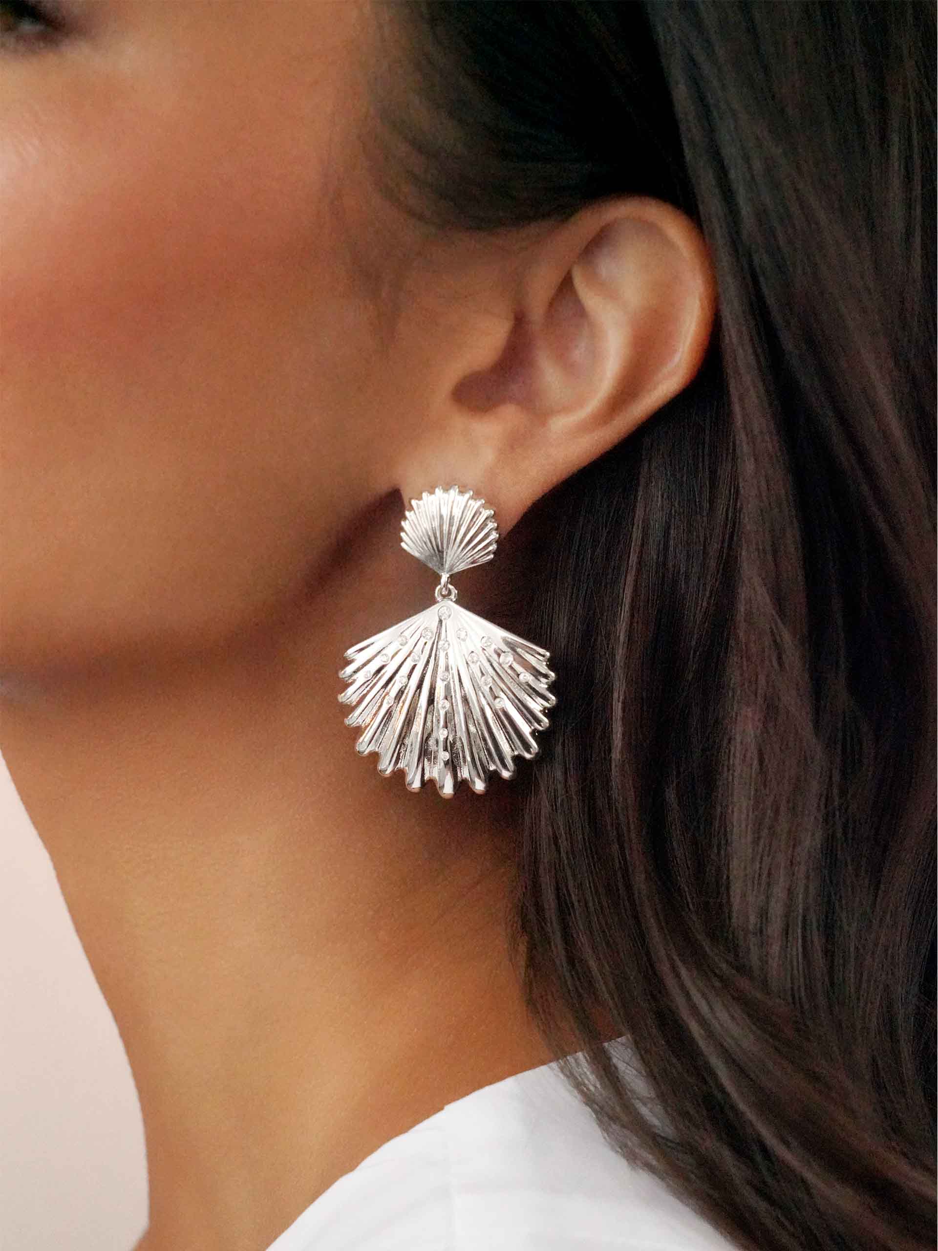 Sun-drenched Shell Earrings on model 3