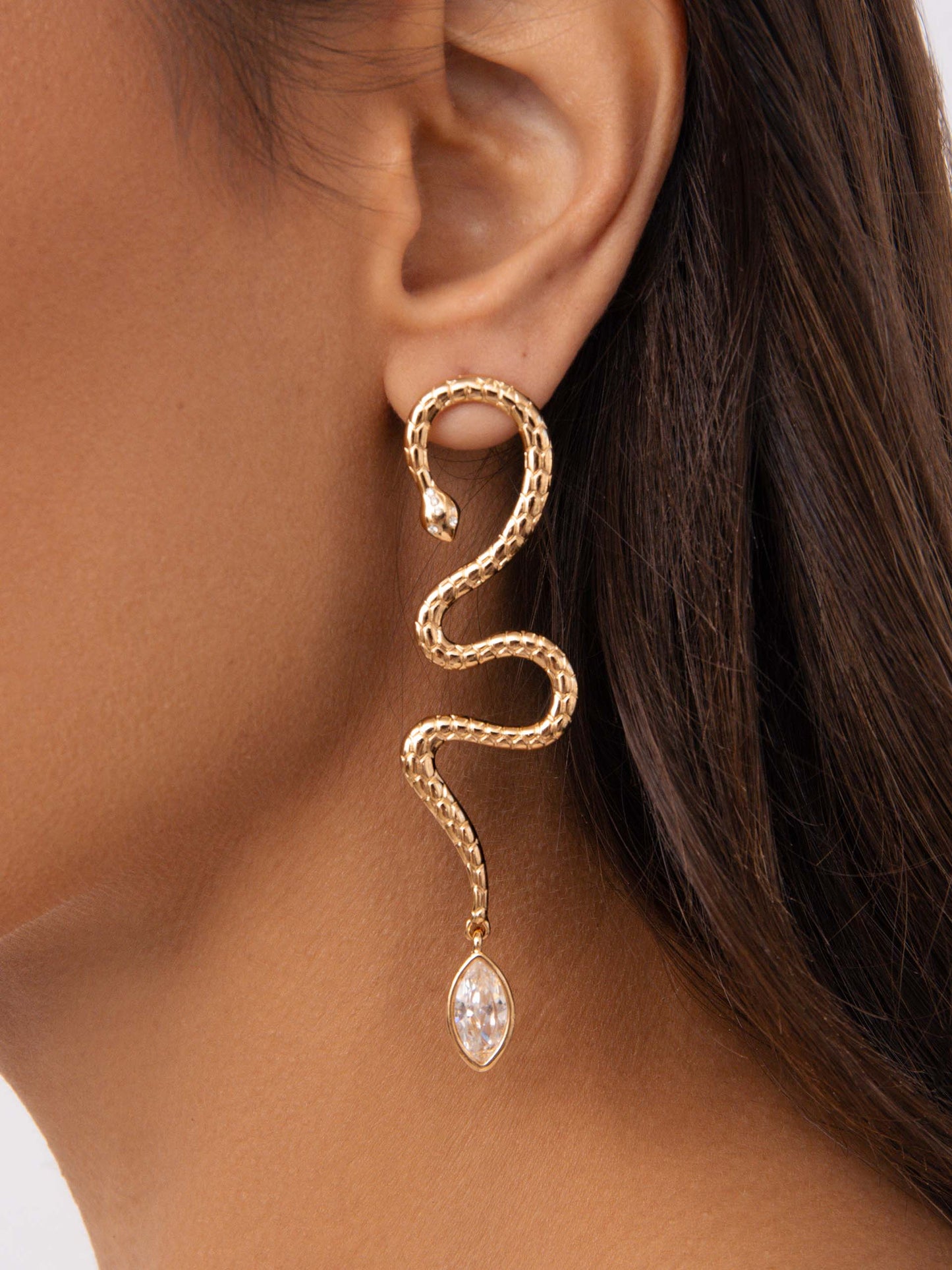 Serpentina Statement Earrings Clear Crystal with 18k Gold Plating on model