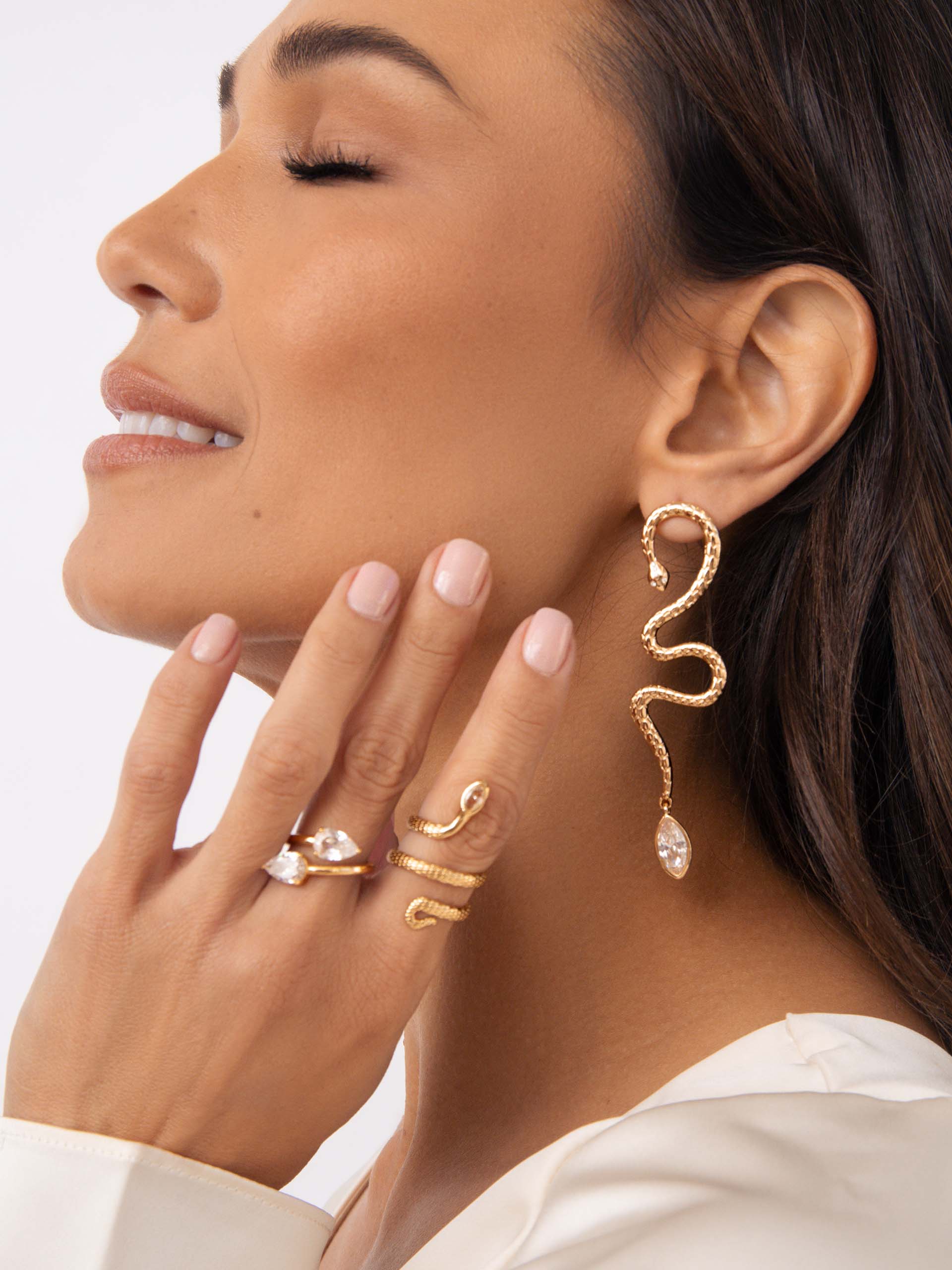 Serpentina Statement Earrings Clear Crystal with 18k Gold Plating on model 2