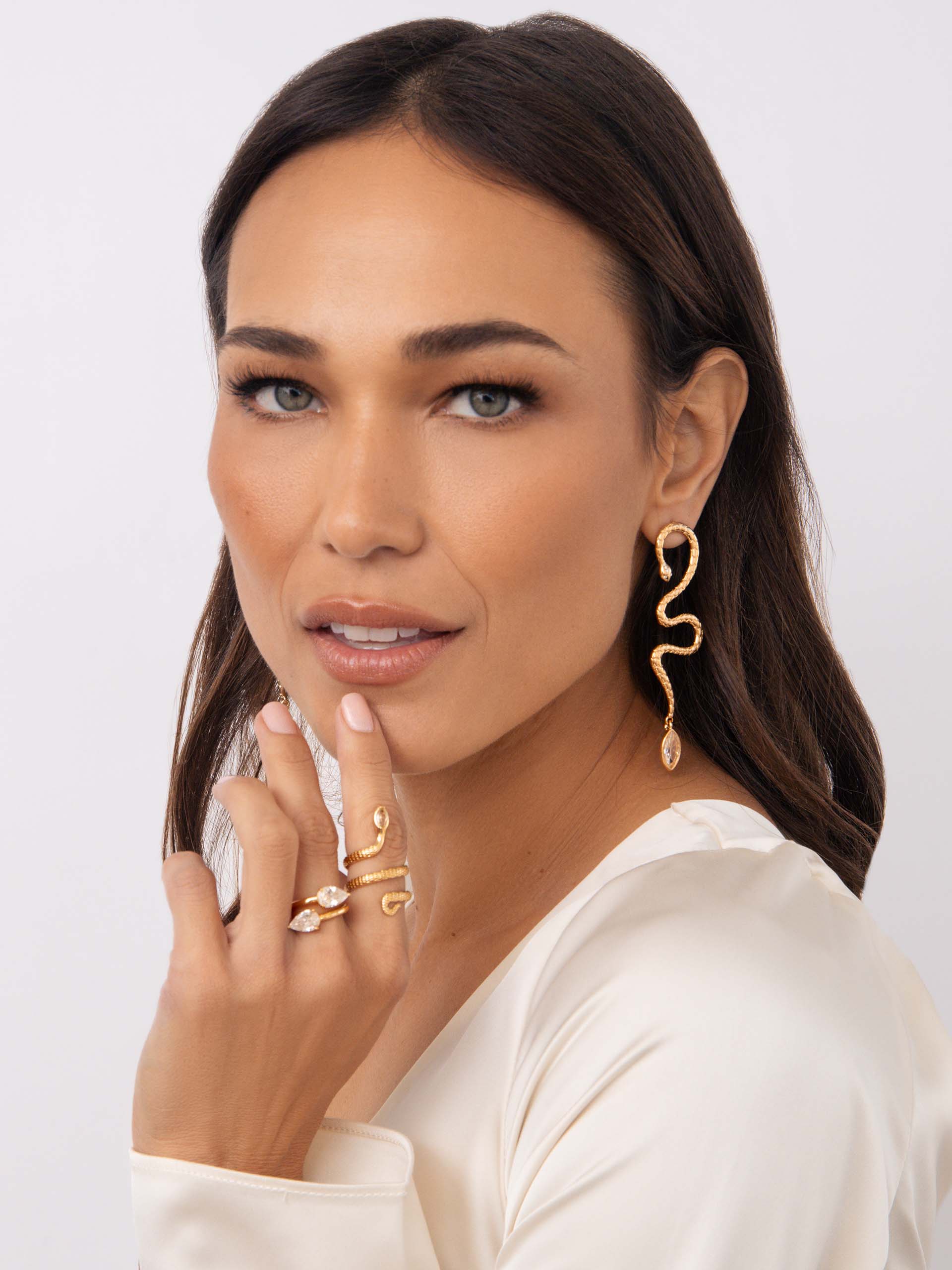 Serpentina Statement Earrings Clear Crystal with 18k Gold Plating on model 4