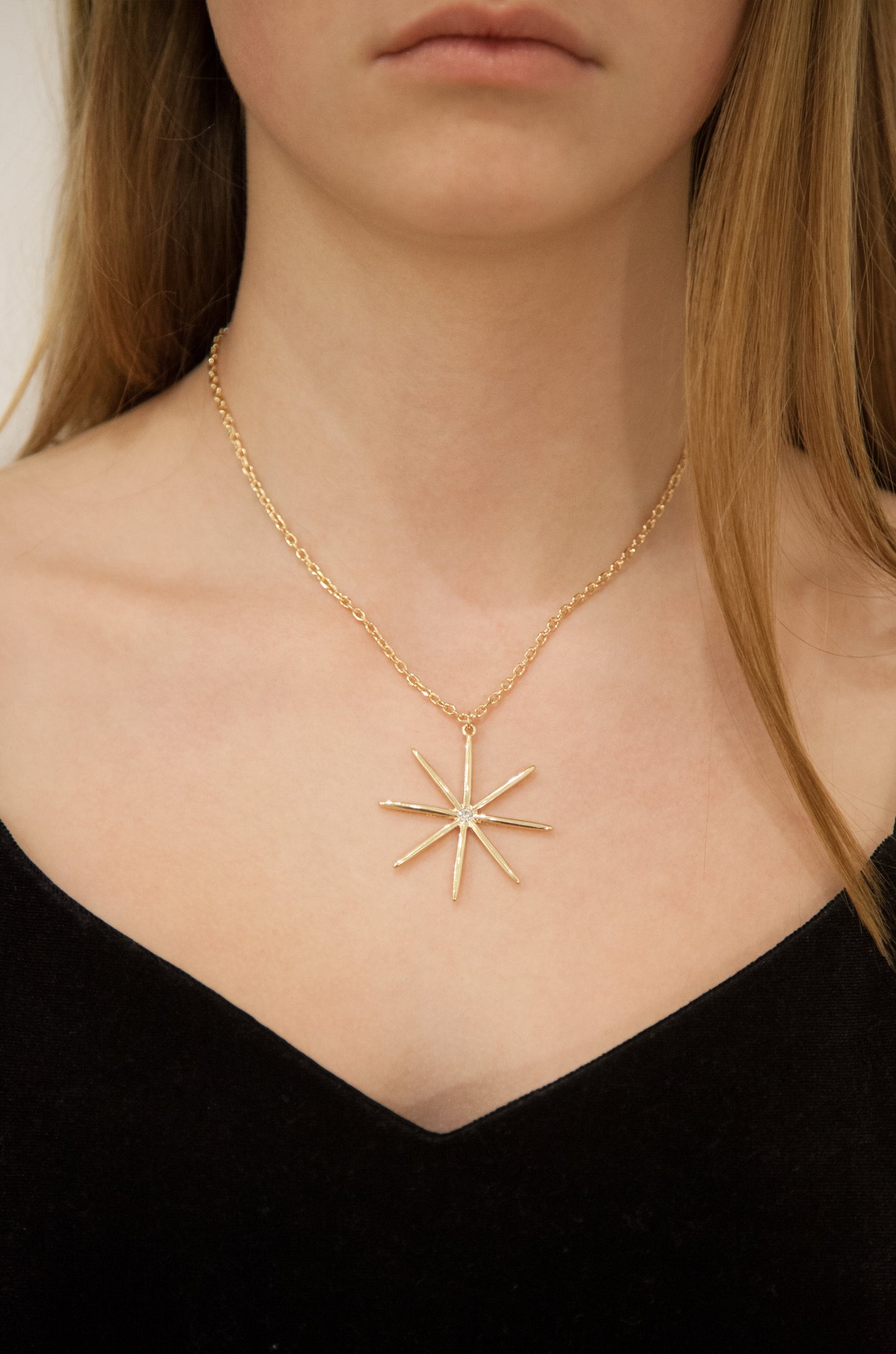 Golden Crystal Star Pendant Necklace on model