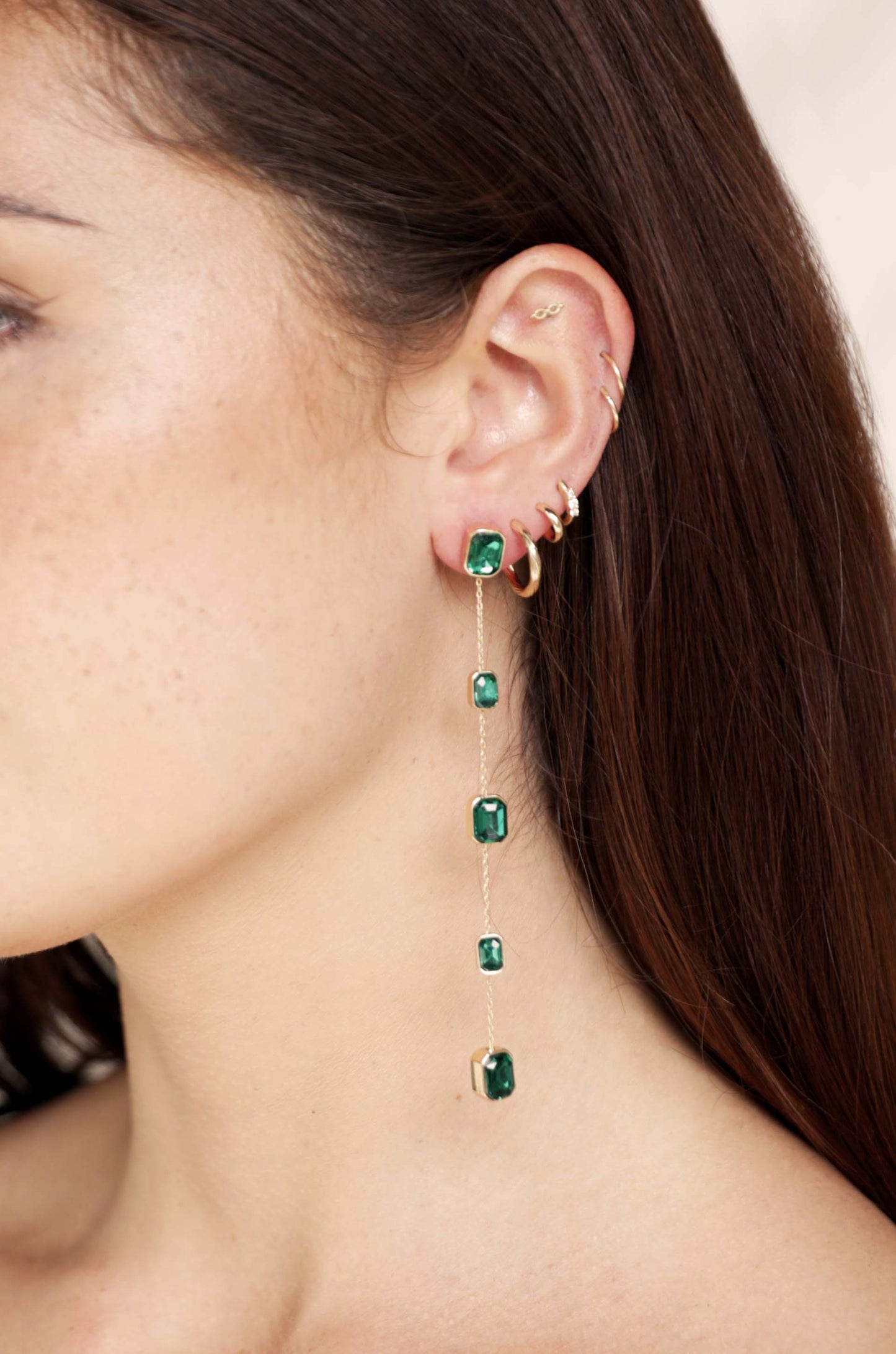 Iconic Crystal Dangle Earrings in green on model