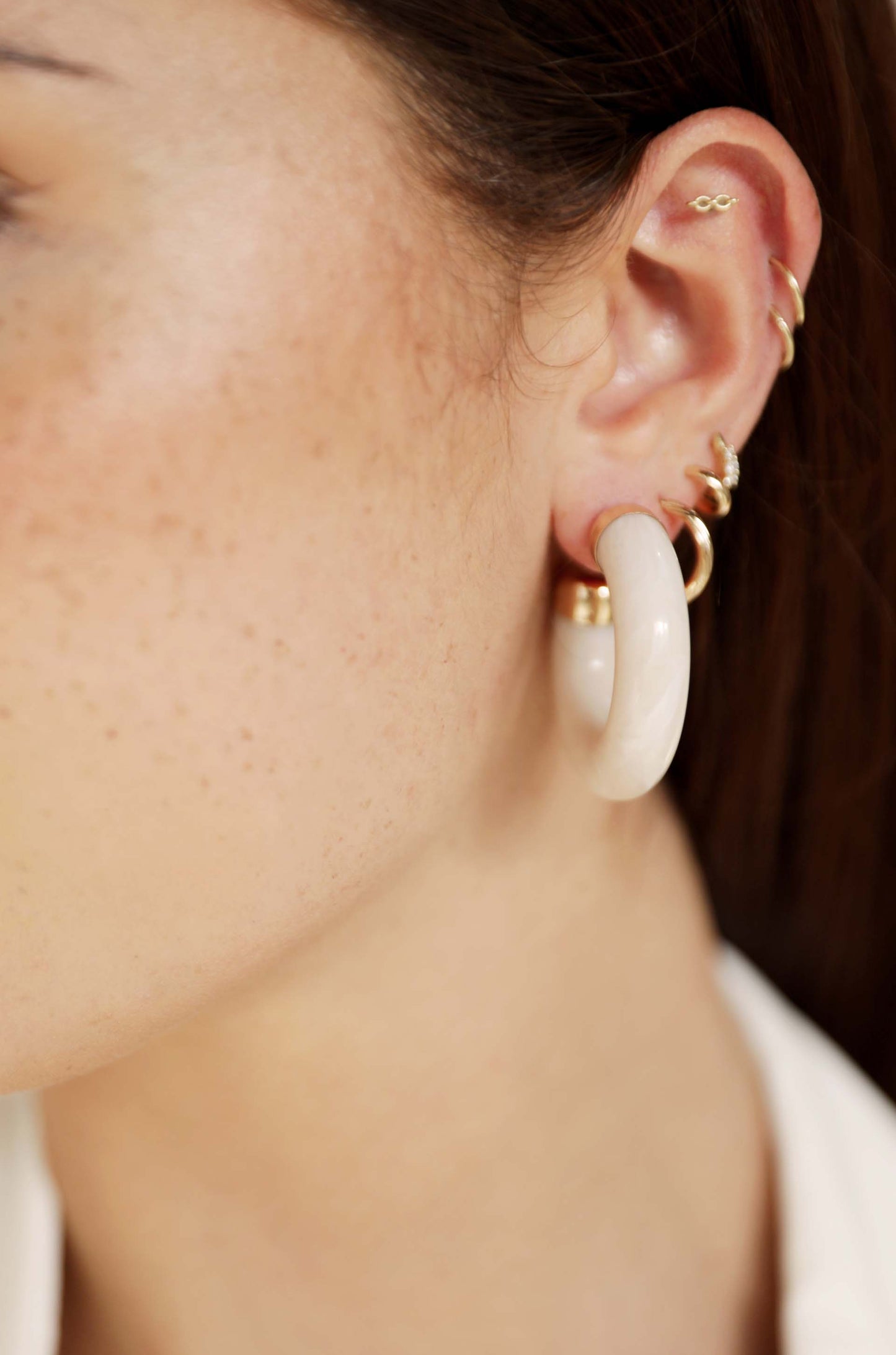Resin Loop 18k Gold Plated Earrings on a model