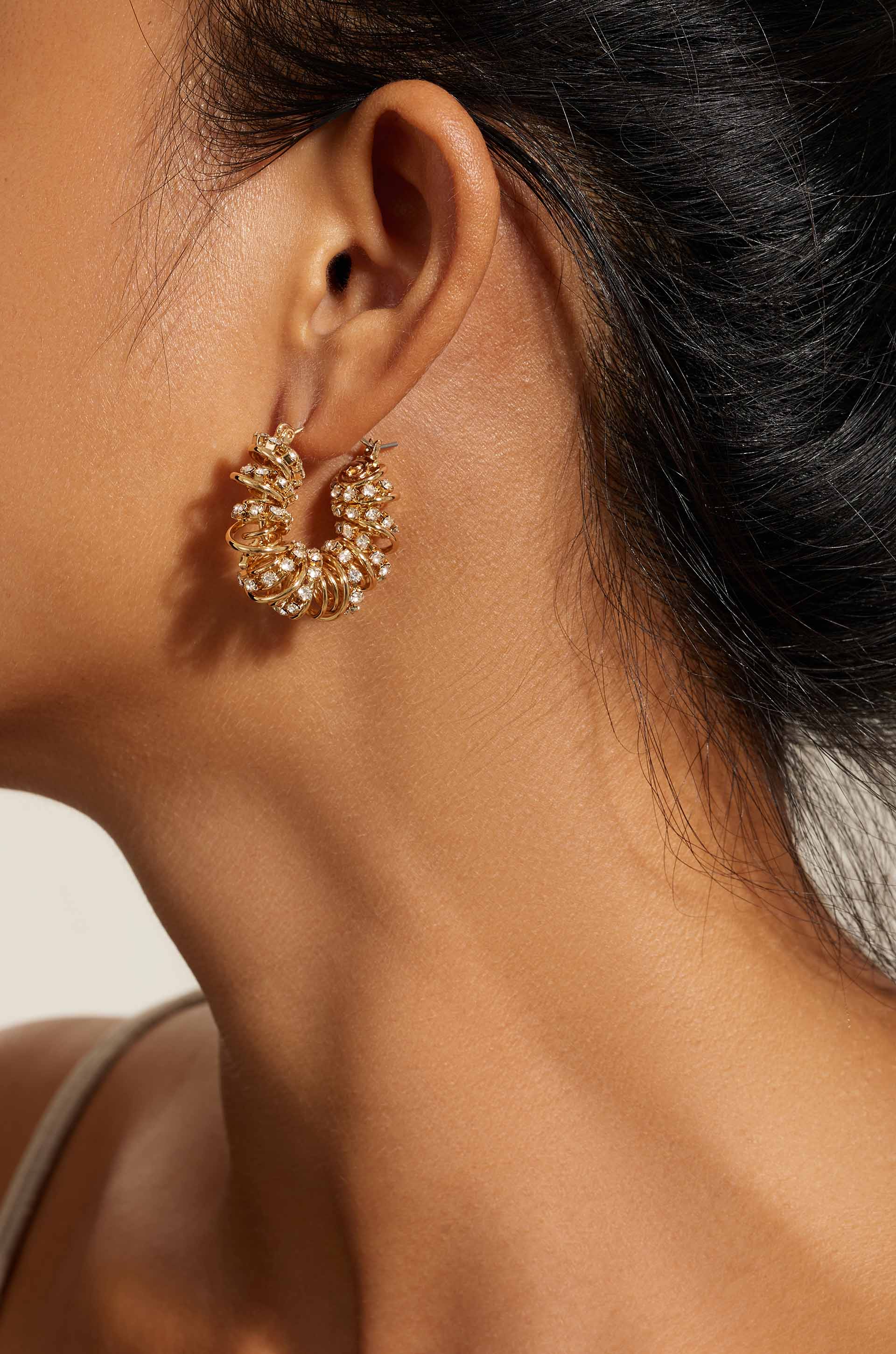 Swirling Crystal Cluster 18k Gold Plated Hoop Earrings on model