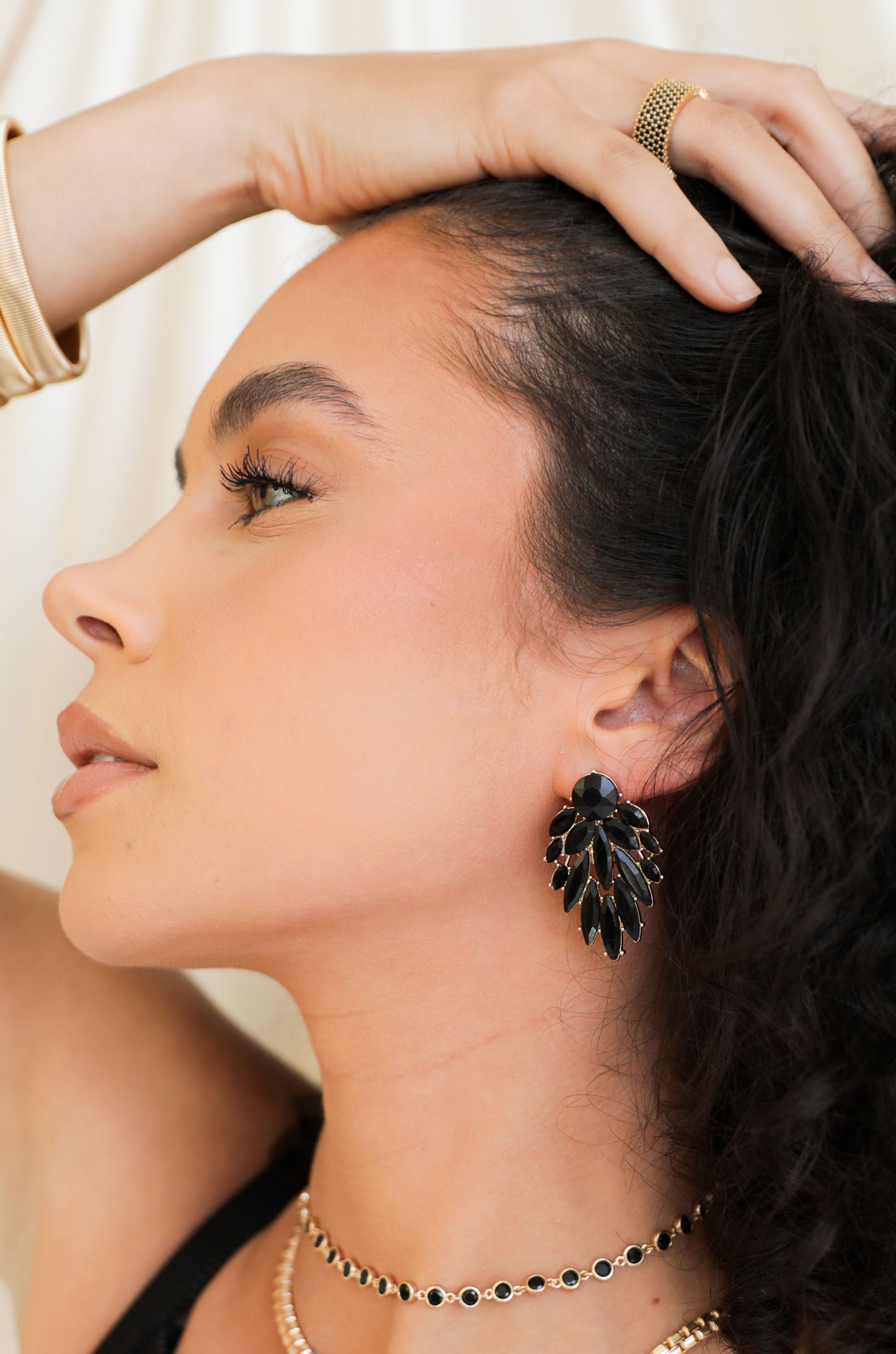 Cry Me A River 18k Gold Plated Earrings in black on a model