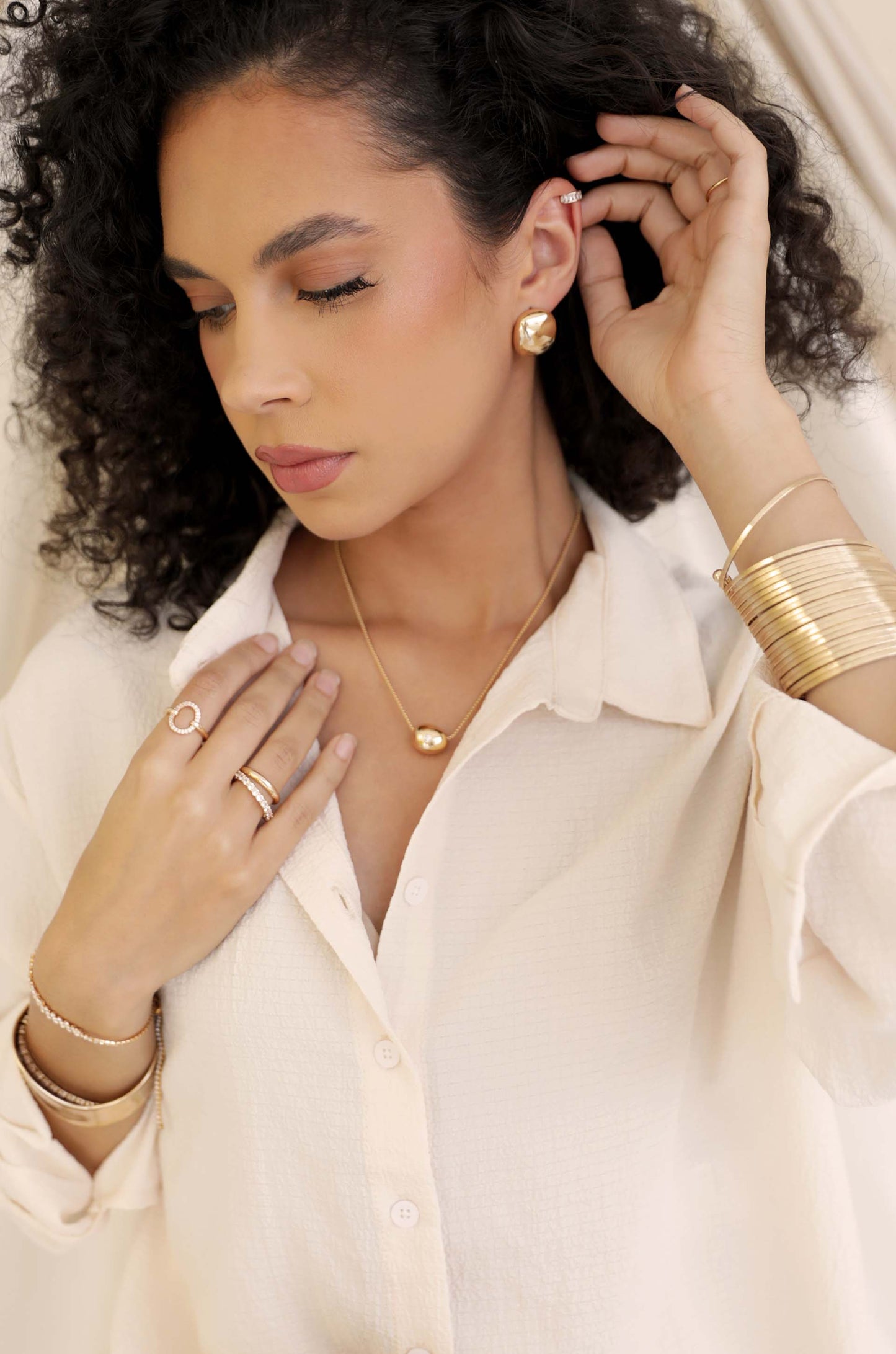 Minimal Curved Square Stud Earrings in gold on model