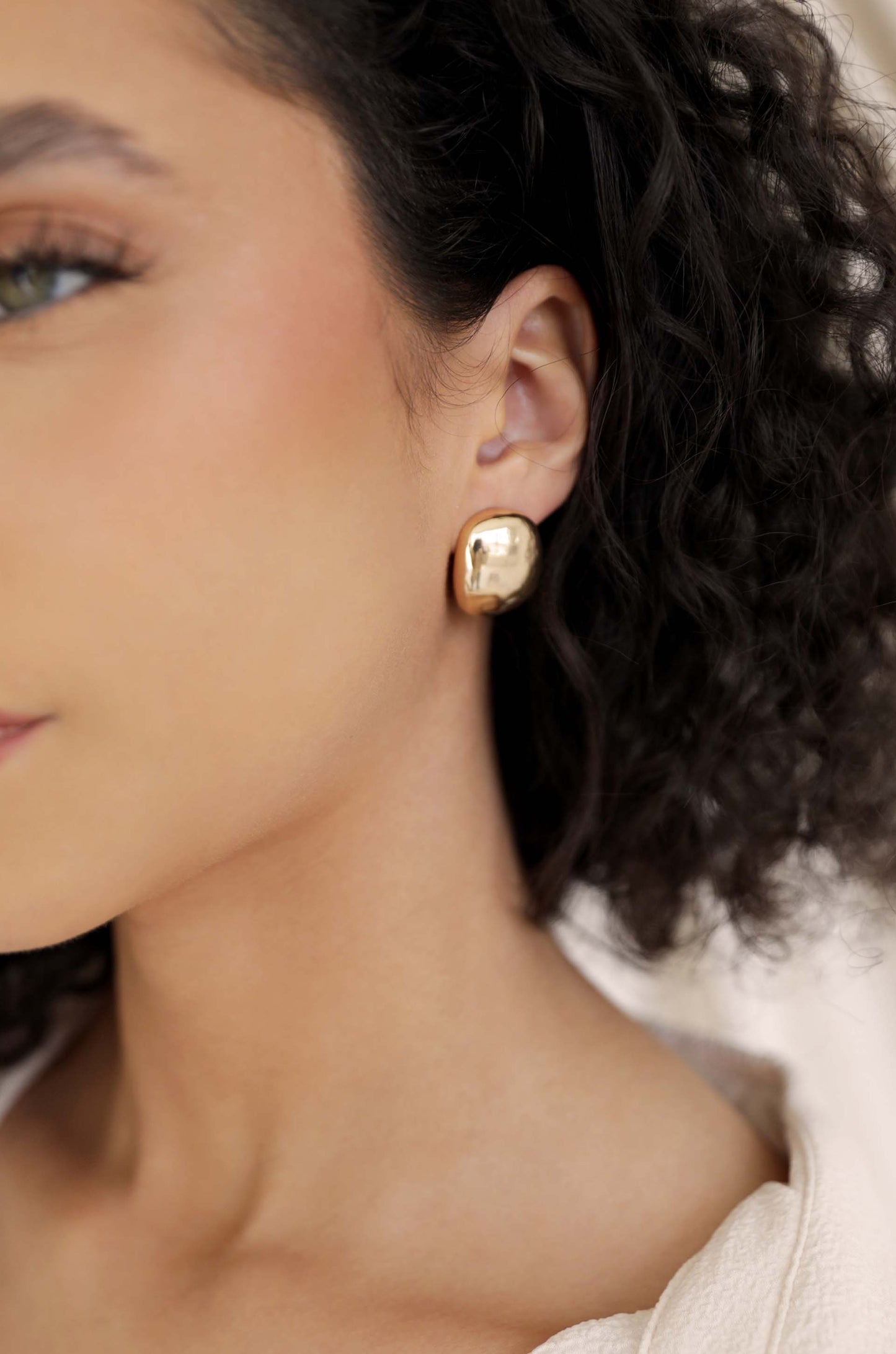 Minimal Curved Square Stud Earrings in gold on model 2