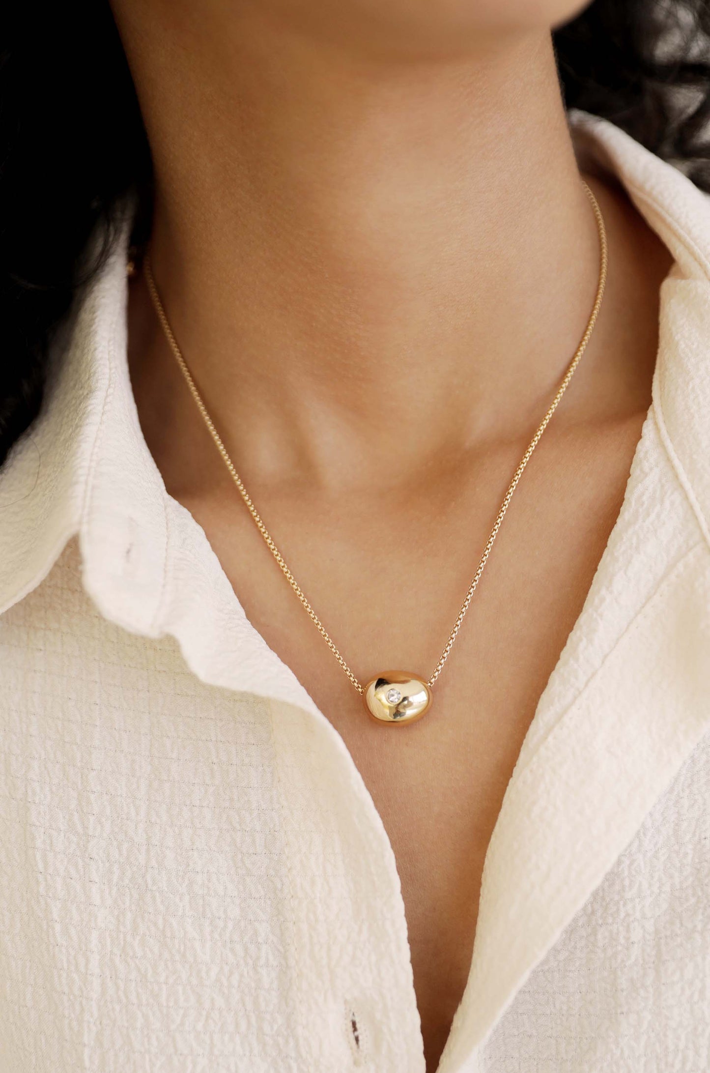 Crystal Dot Pebble Pendant Necklace on model