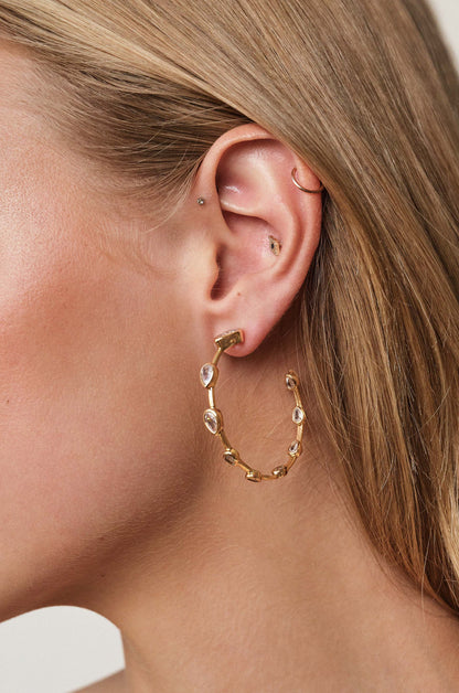 Beauty Bezel Crystal 18k Gold Plated Hoop Earrings on model