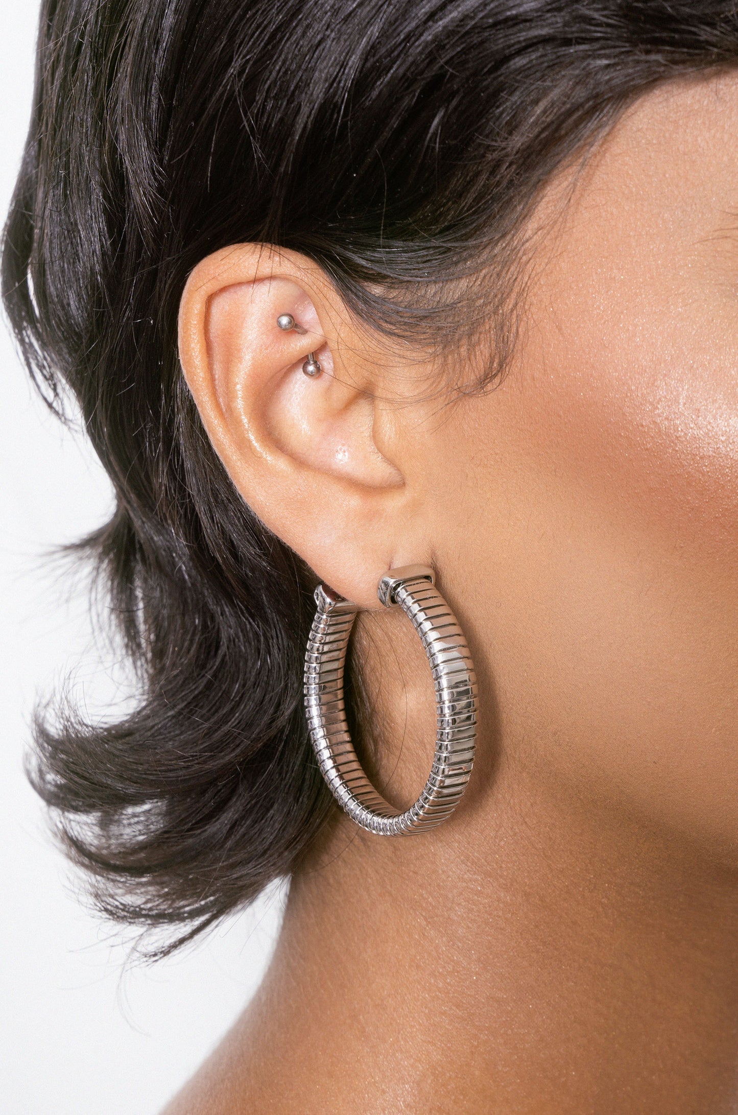 Your Essential Flex 18k Gold Plated Hoops in rhodium on model