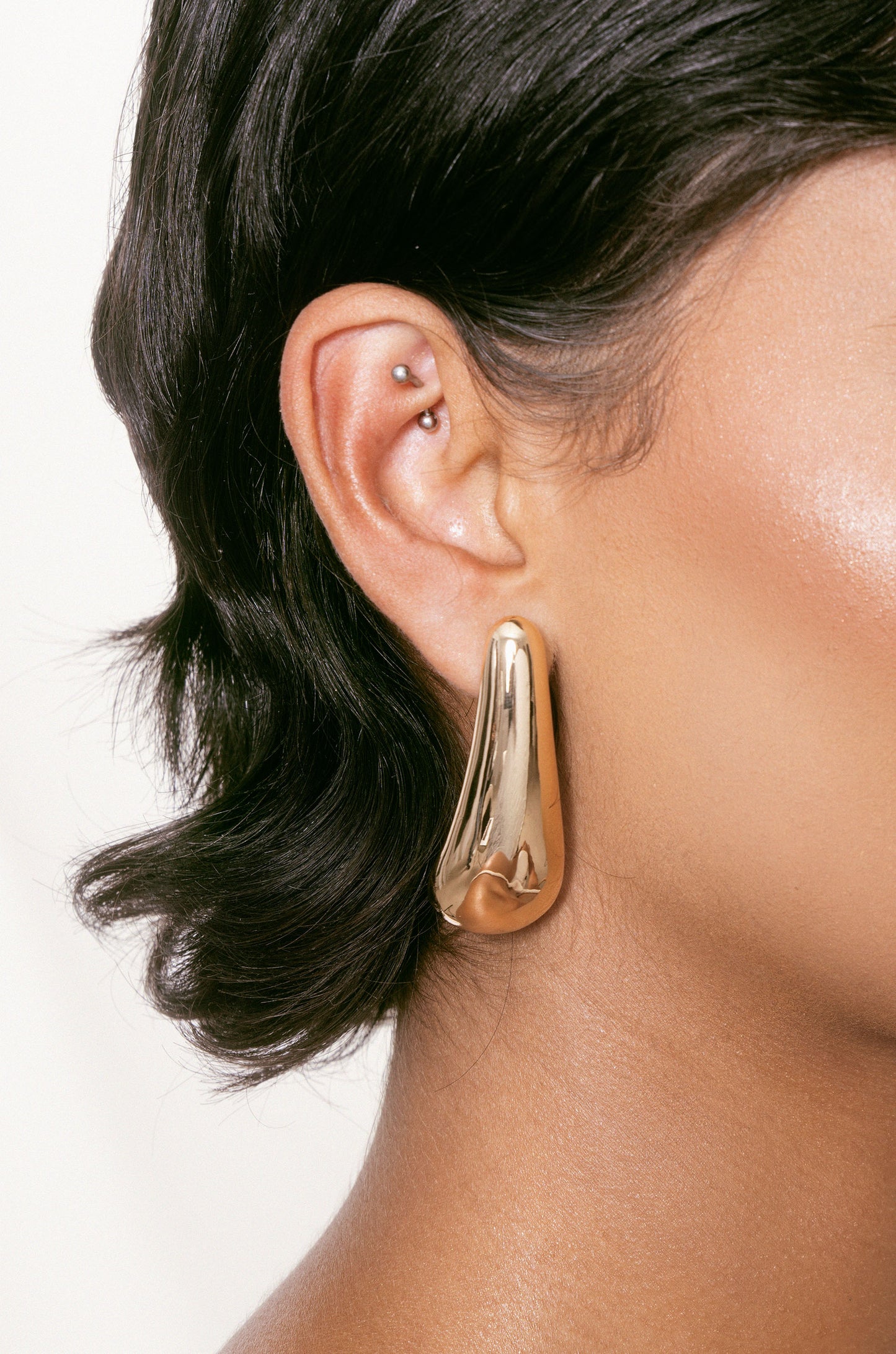 Raindrop Earrings in gold on model