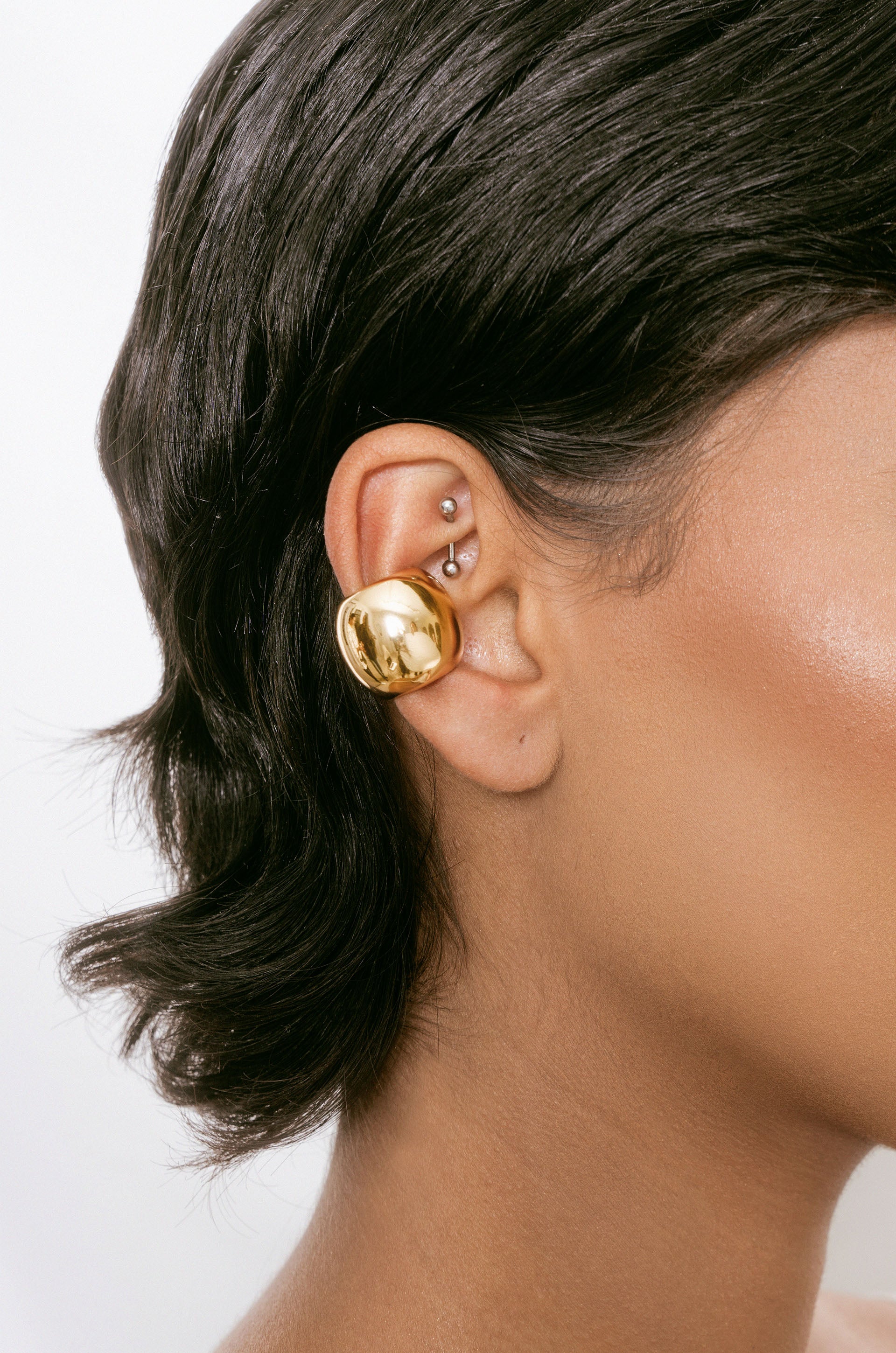 Chunky Metal Ear Cuff in gold on model