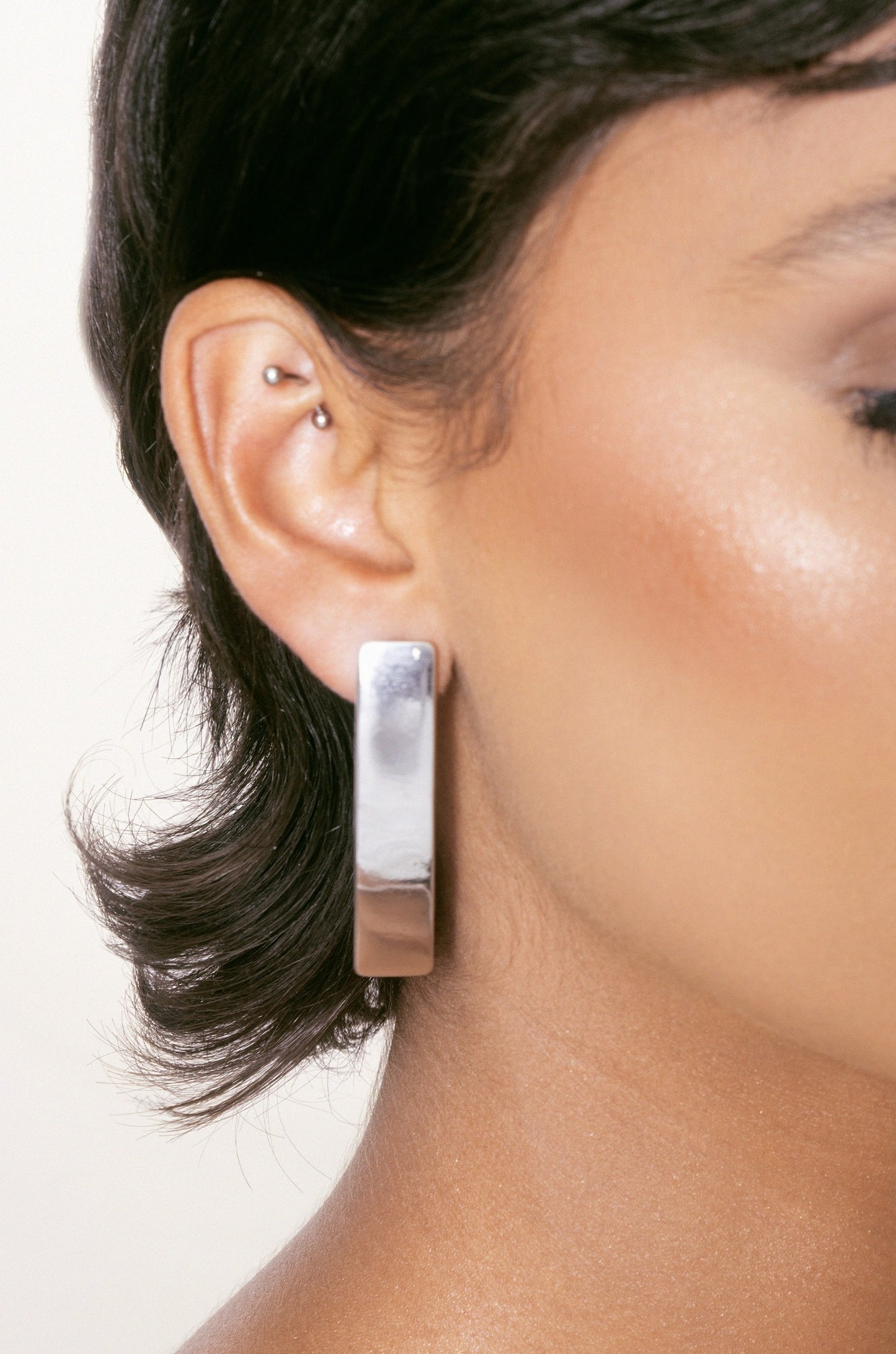 Single Bar Earrings in rhodium on model
