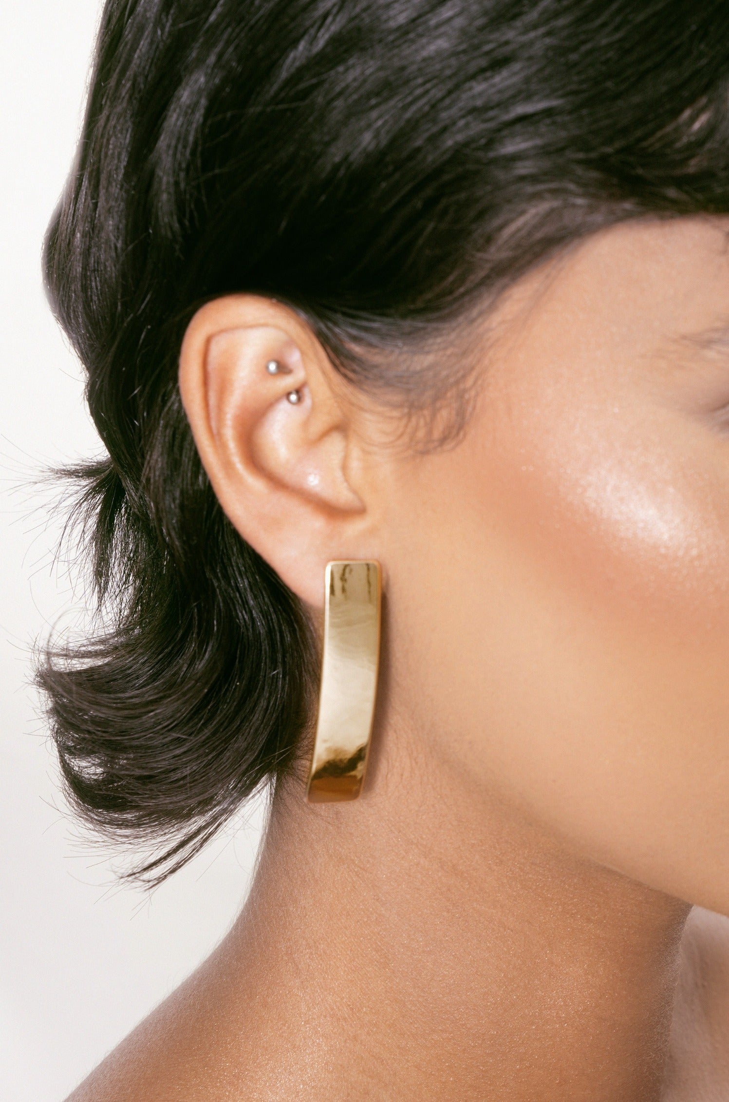 Single Bar Earrings in gold on model