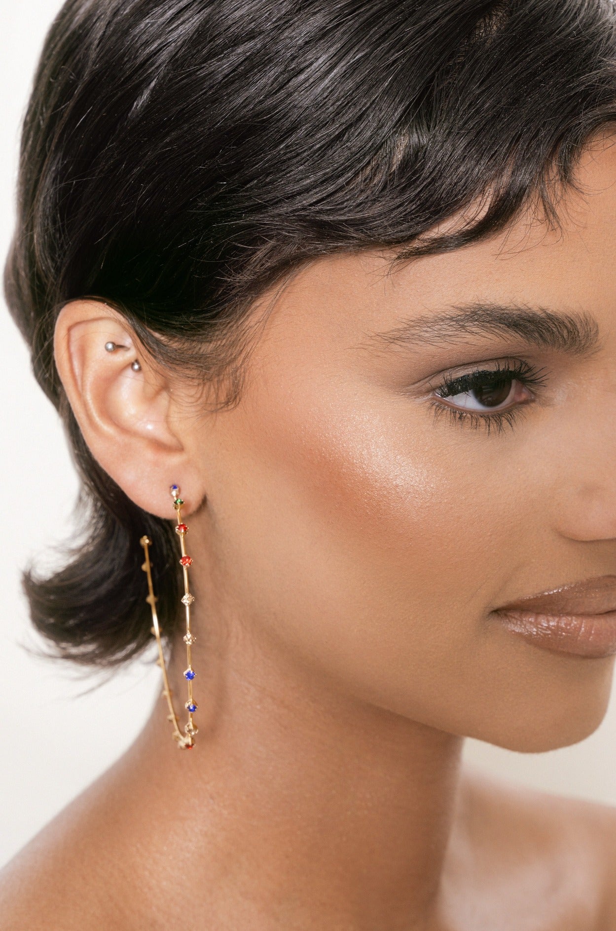 Simple Spark Crystal Hoops in rainbow on model