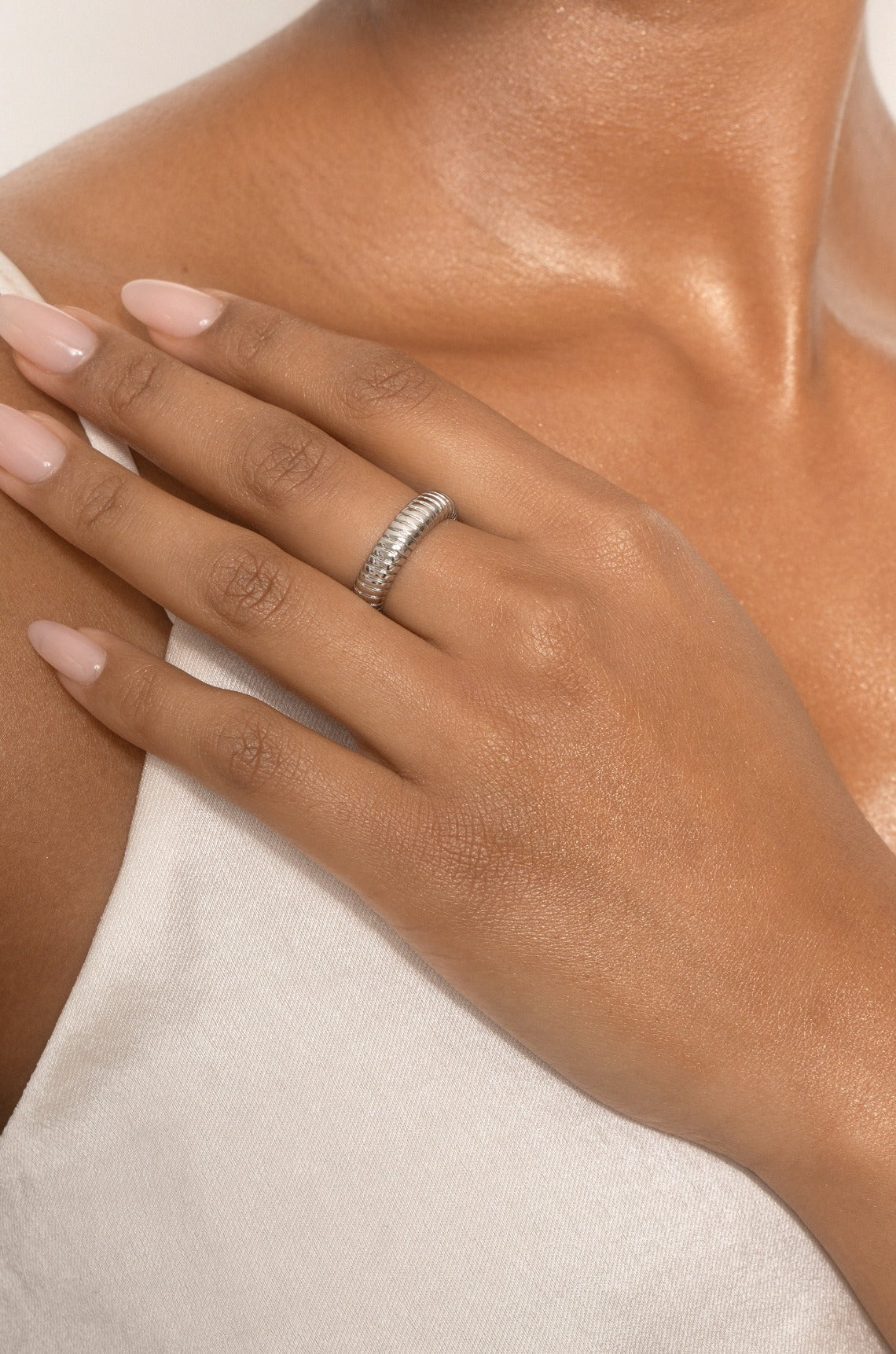 Your Essential 18k Gold Plated Twisted Flex Ring on model in rhodium