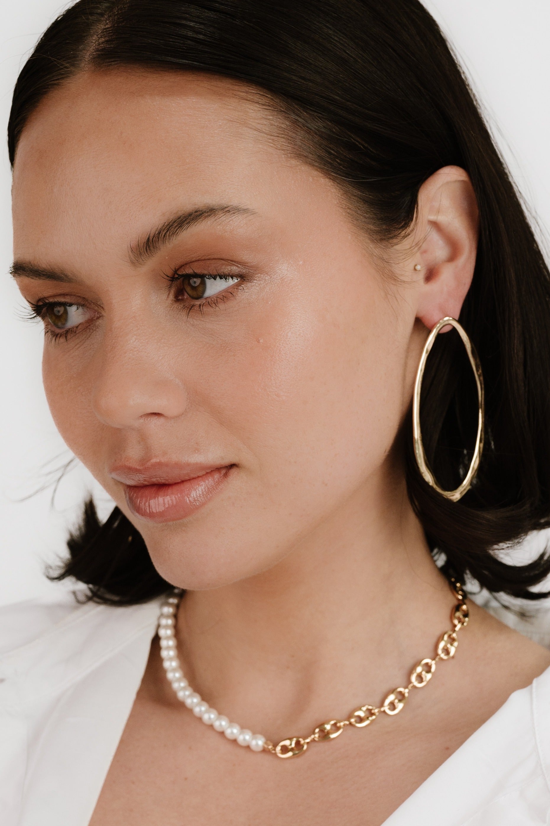 Hammered Large Oval Earrings on model 3