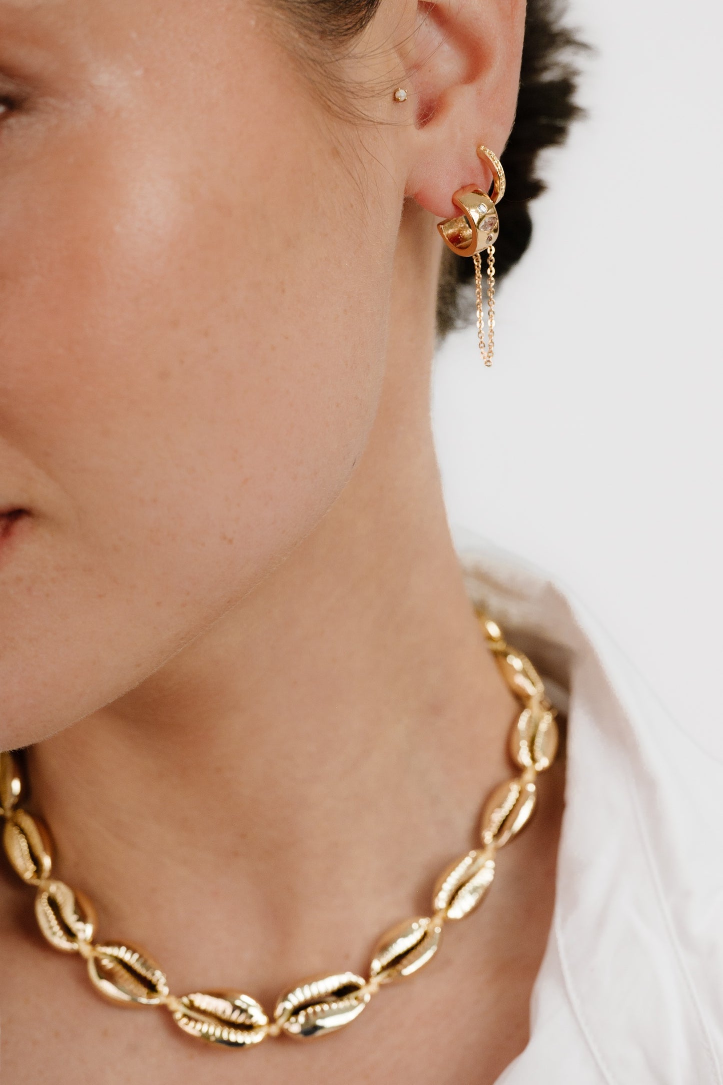 Double Piercing Bezel Crystal Dangle Earrings on model 3
